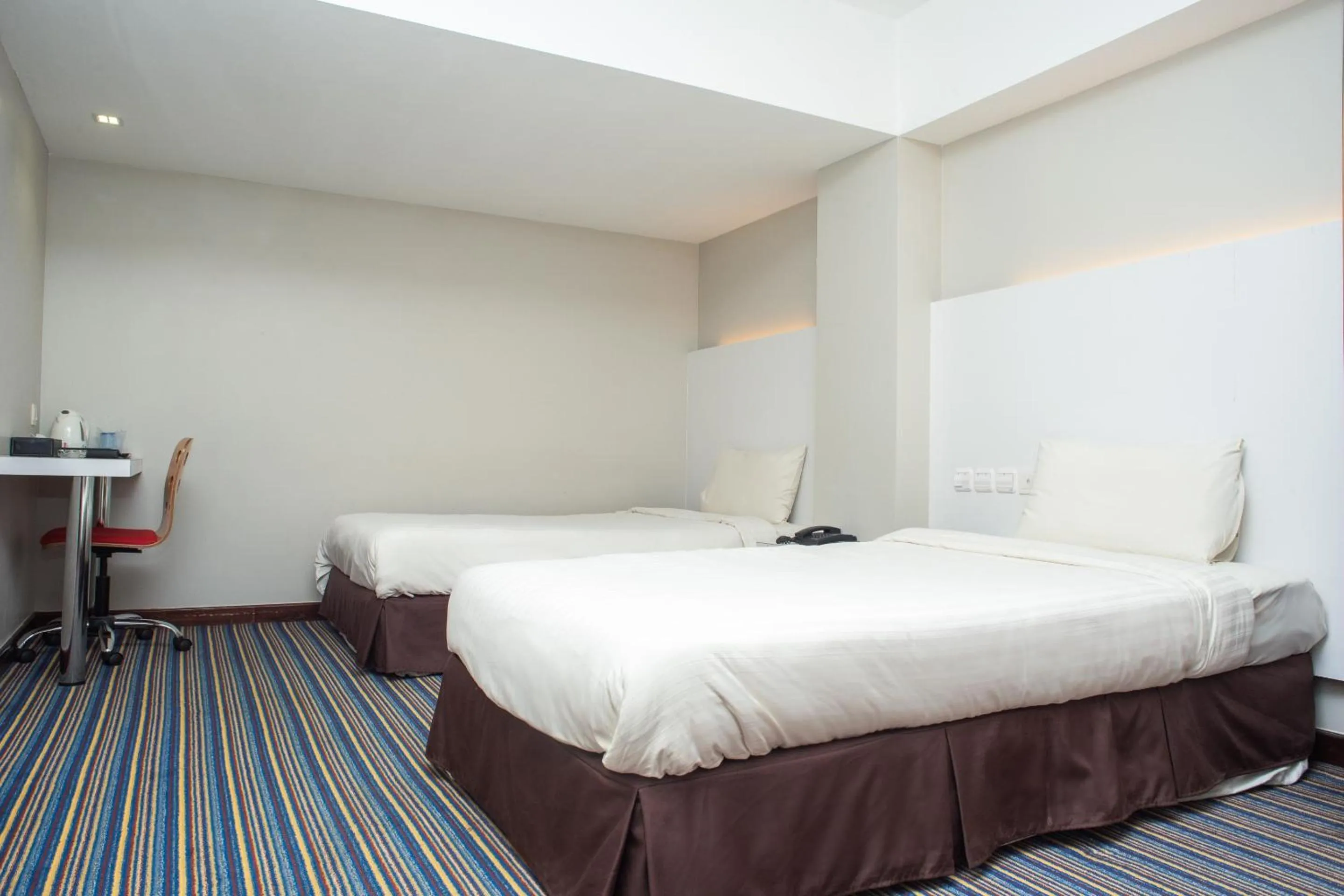 Bedroom in Capital O 90083 Riverfront Inn