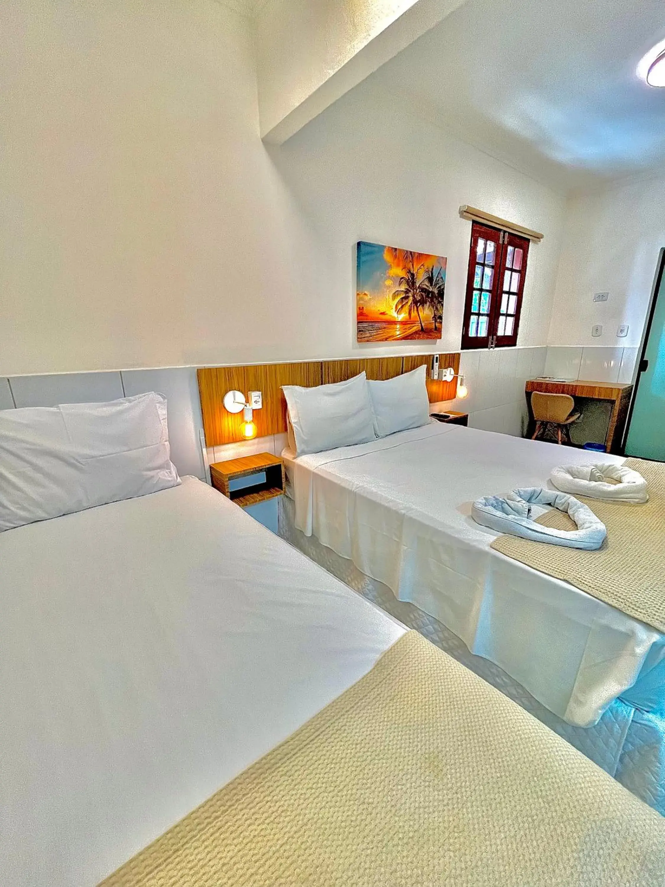 Triple Room with Private Bathroom in Pousada La Riviera - Pé na areia e Passeios em Maragogi Triple Room with Private Bathroom in Pousada La Riviera - Pé na areia e Passeios em Maragogi