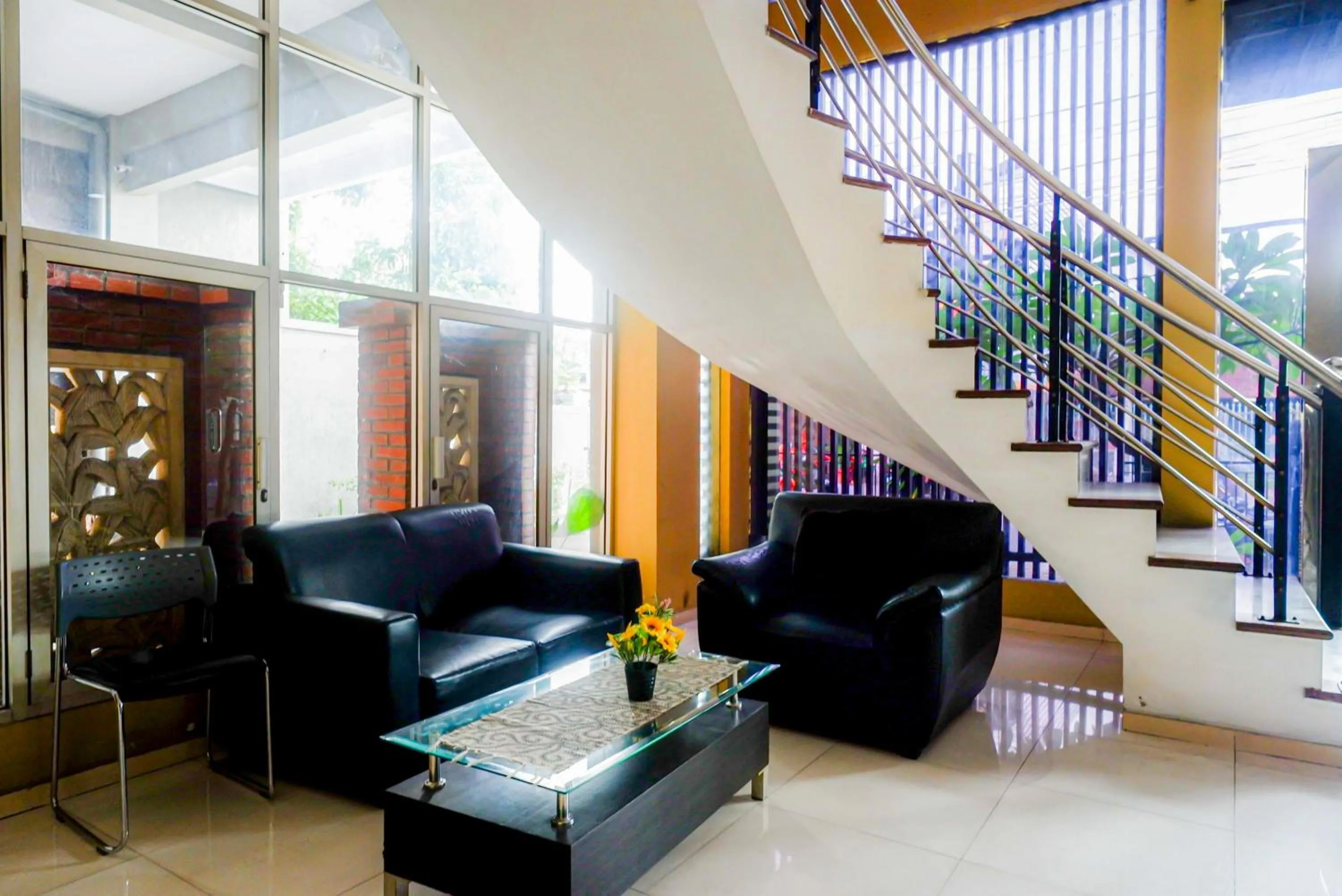 Seating area in RedDoorz Plus near Amplaz Yogyakarta