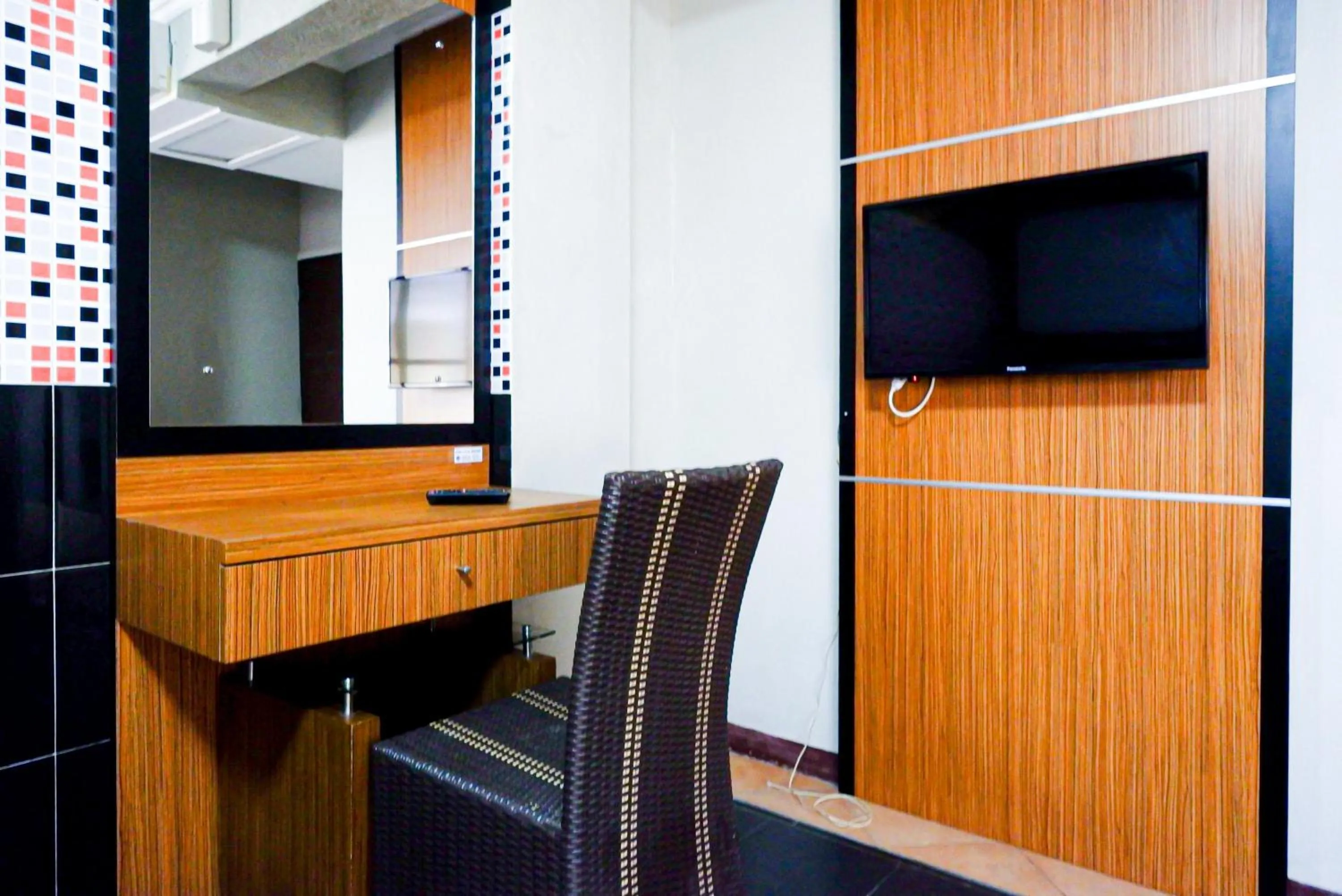 Seating area in RedDoorz Plus near Amplaz Yogyakarta