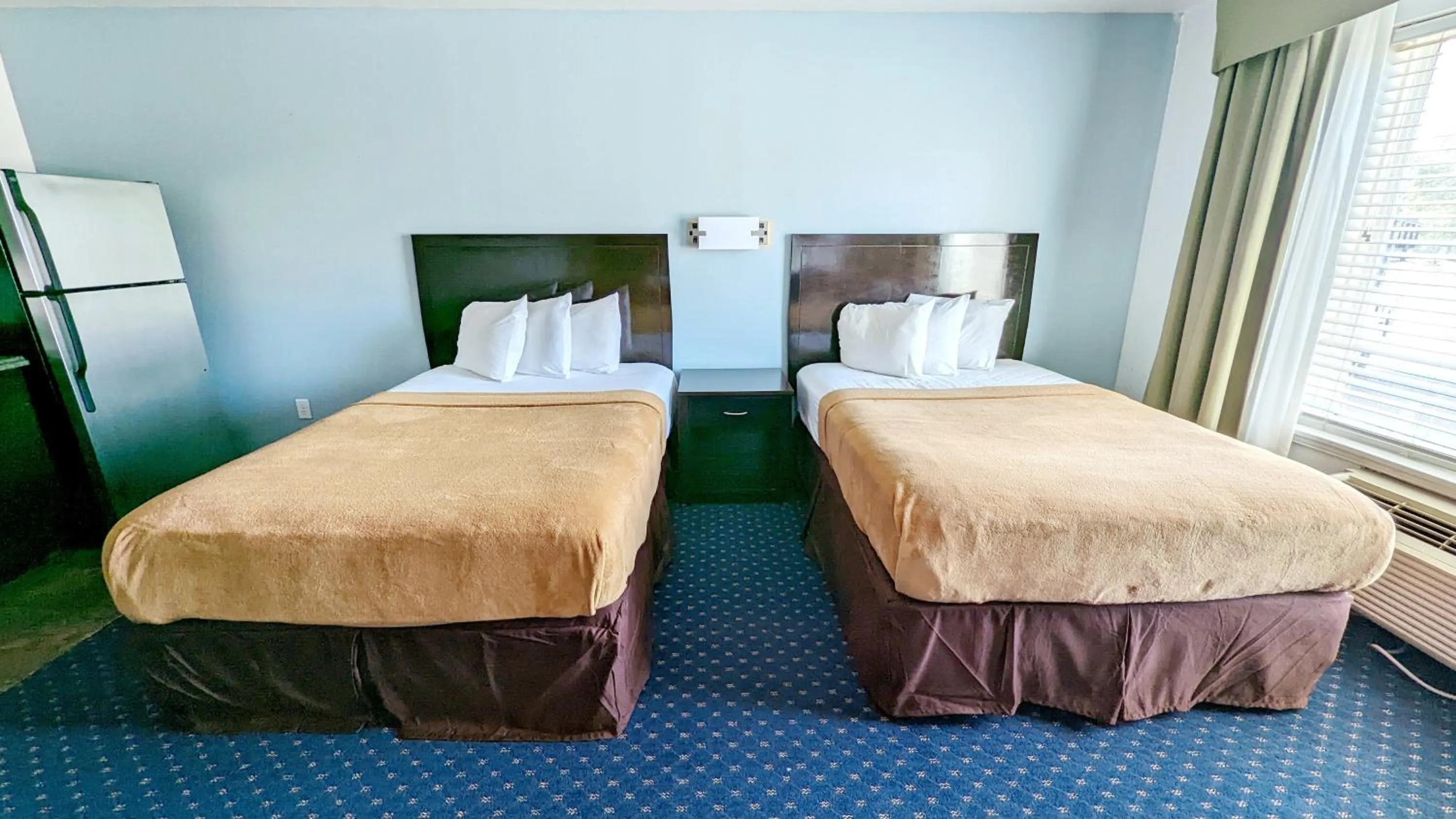 Bed in FairBridge Inn & Suites Canadian