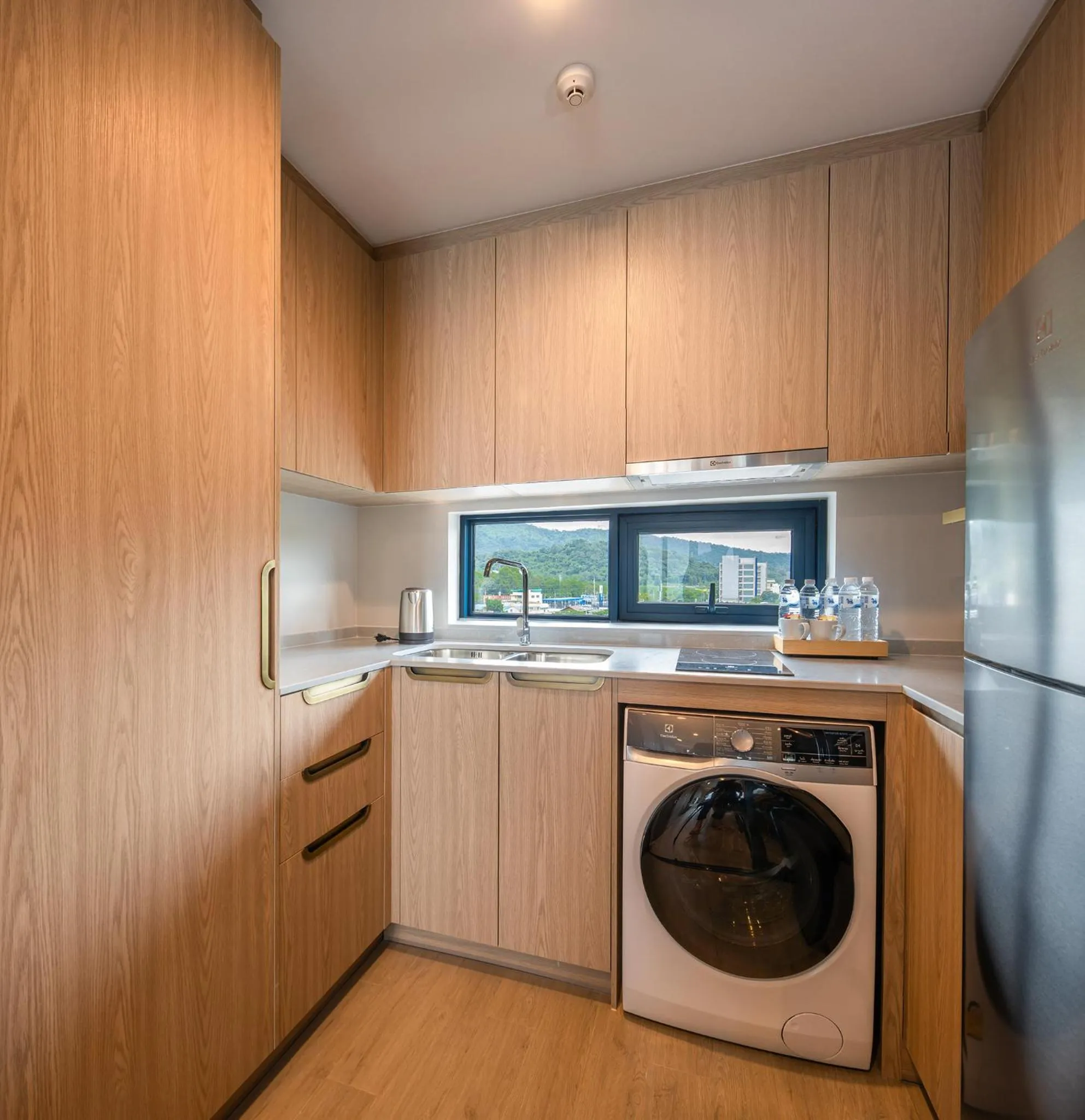 Kitchen or kitchenette in S Sriracha Hotel & Residence