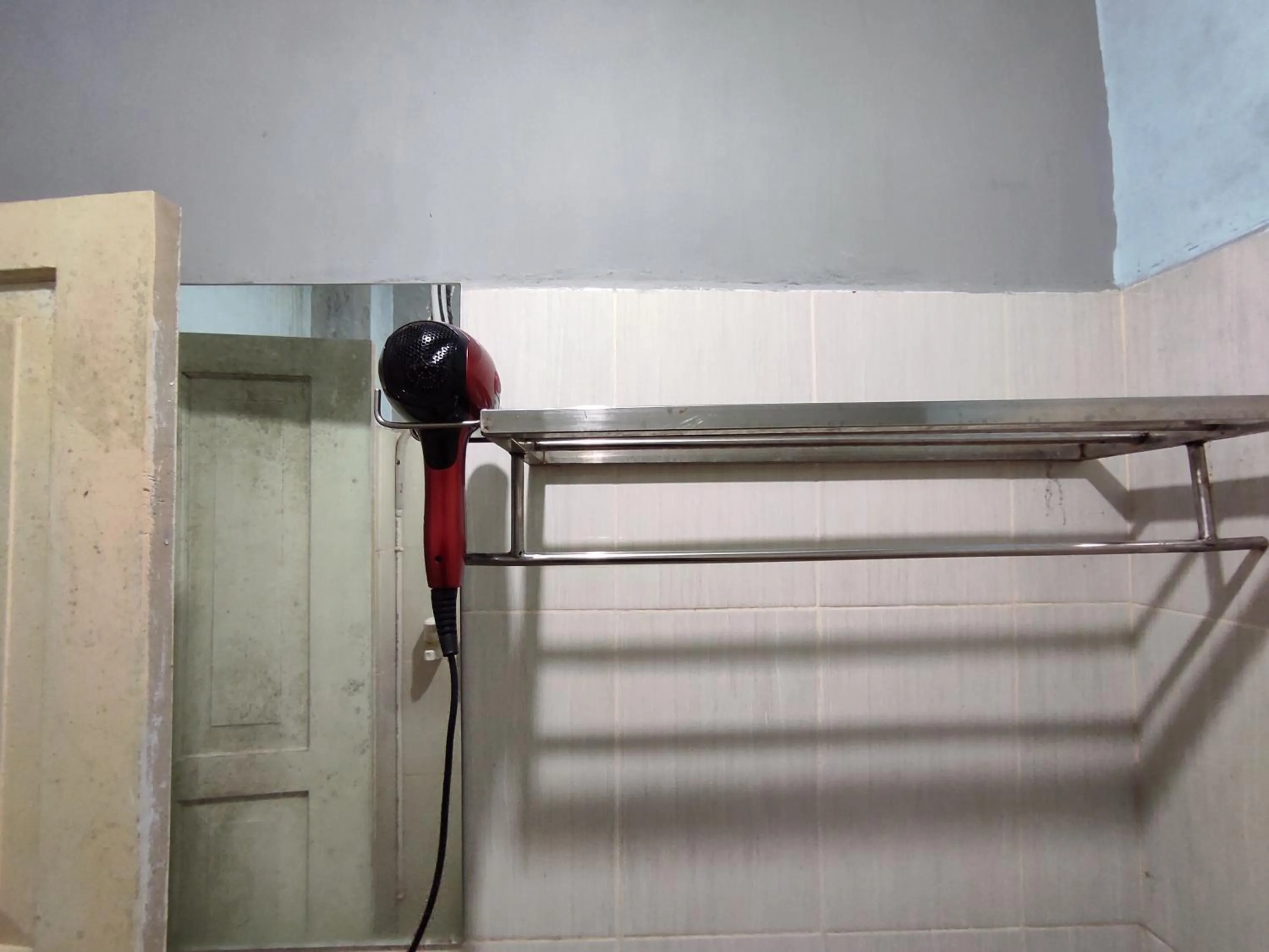 Bedroom in OYO 93411 Syariah Hotel Tomborang