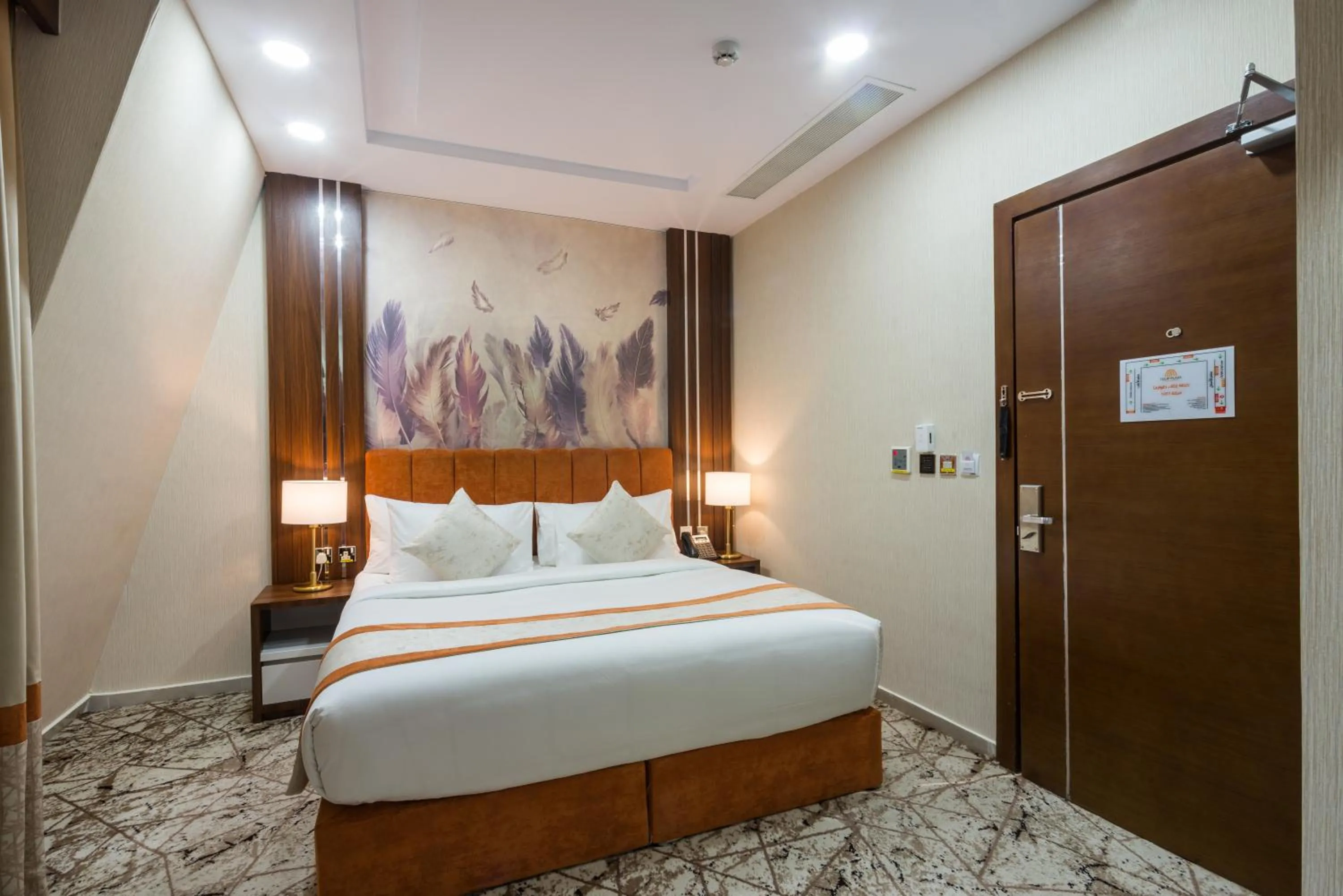 Bed in Tulip Plaza Hotel