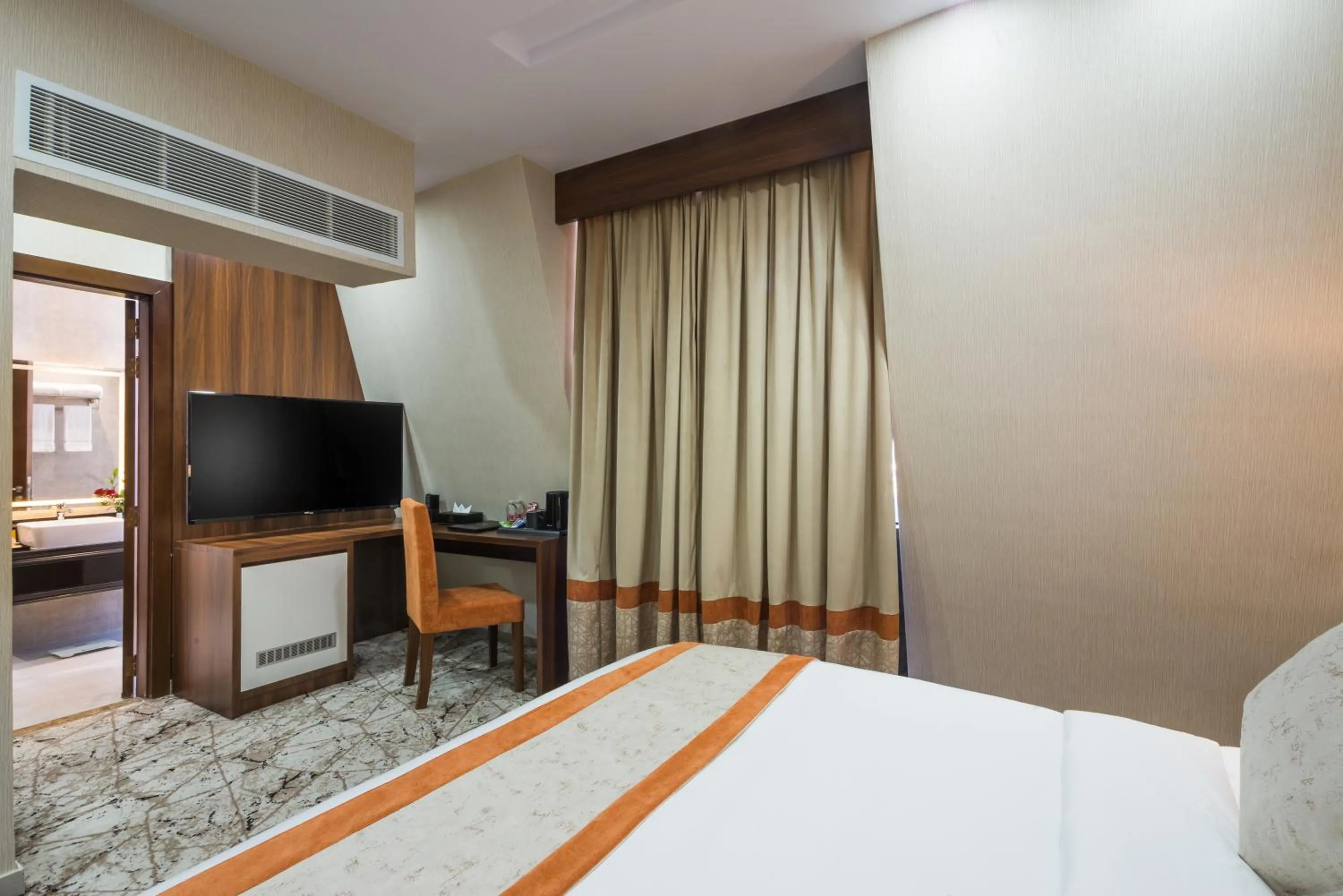 Communal lounge/ TV room in Tulip Plaza Hotel