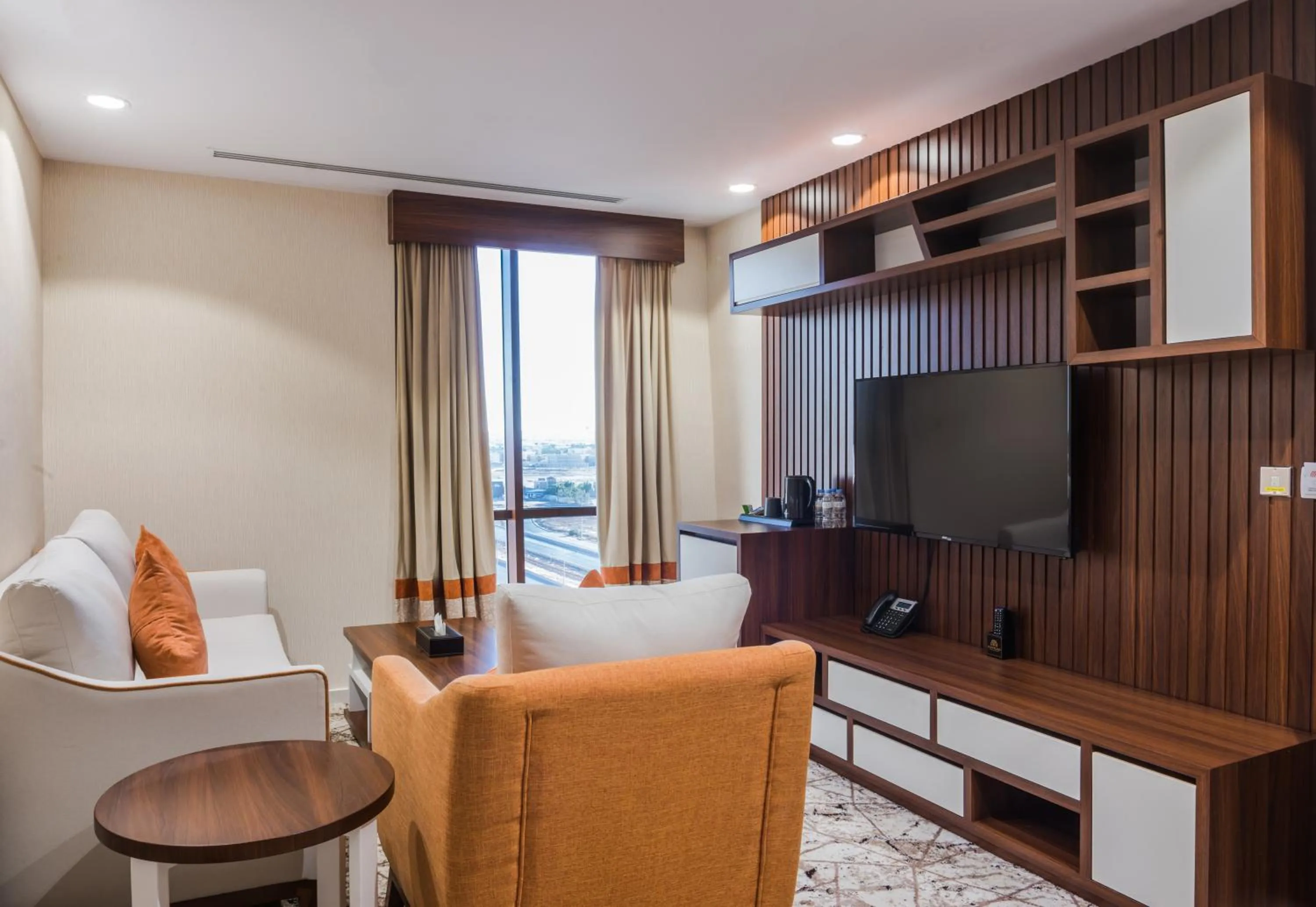 Communal lounge/ TV room in Tulip Plaza Hotel