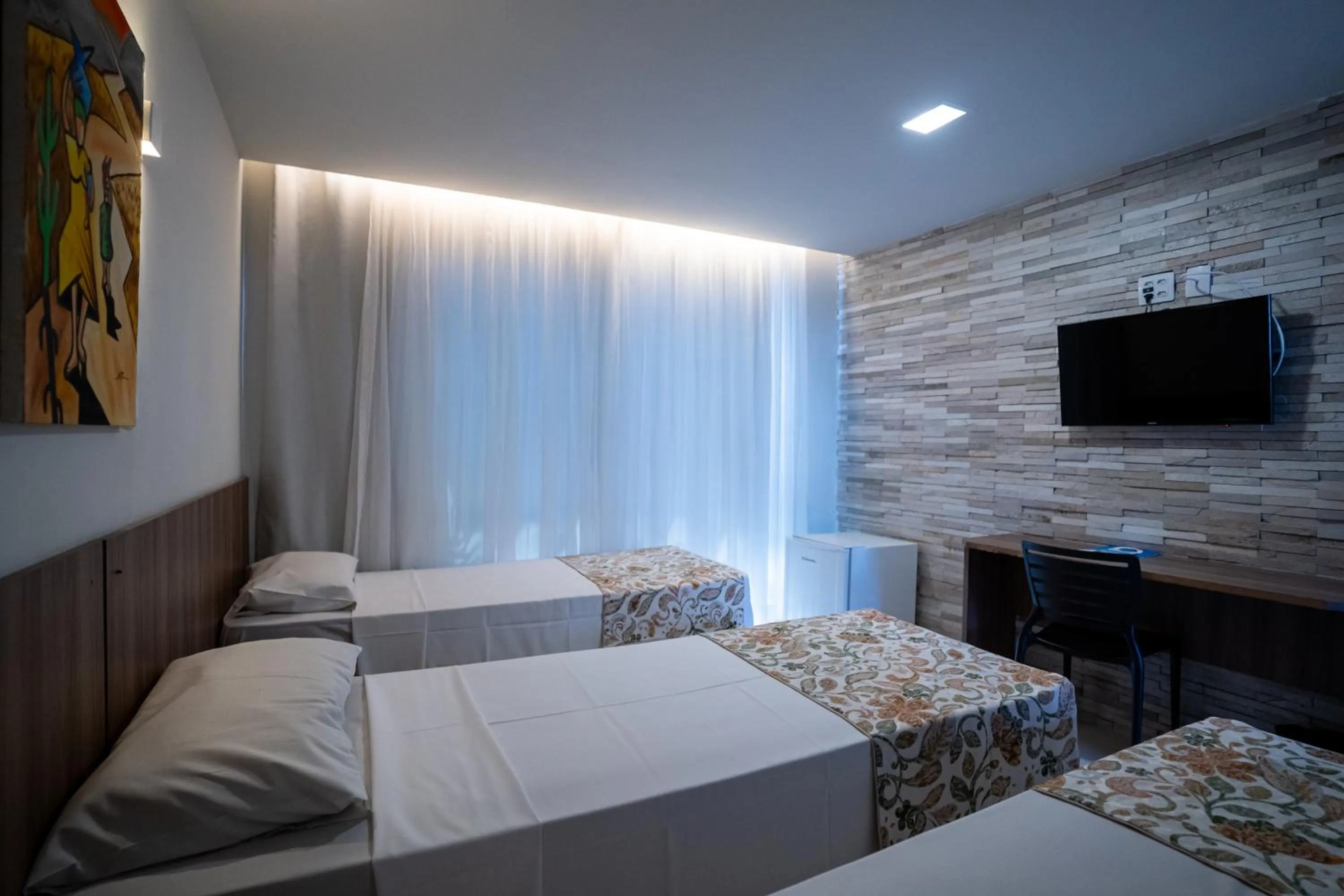 Communal lounge/ TV room, Bed in Bessa Beach Hotel