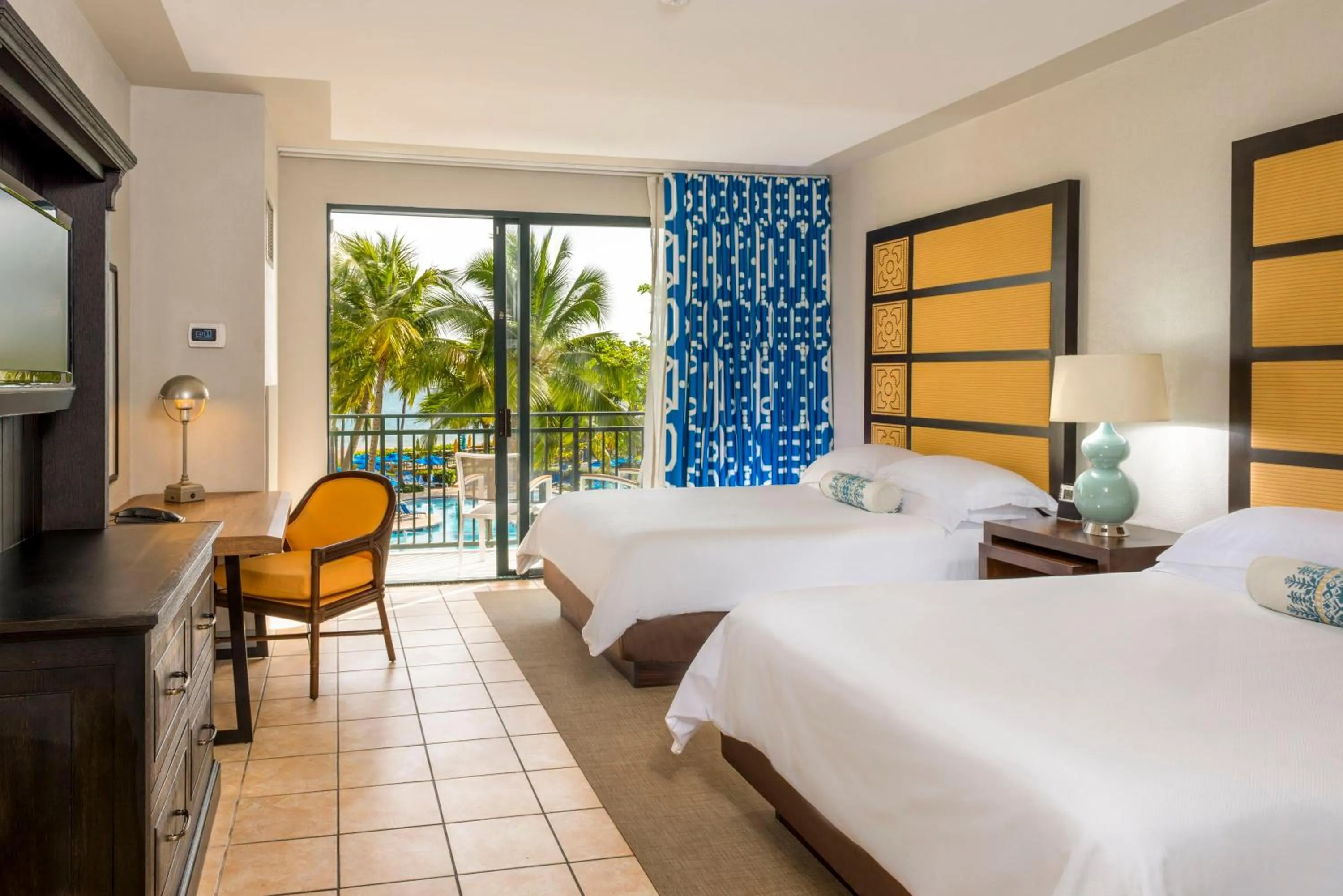 Discovery Collection Queen Room with Two Queen Beds and Balcony - Pool View in Wyndham Grand Rio Mar Rainforest Beach and Golf Resort