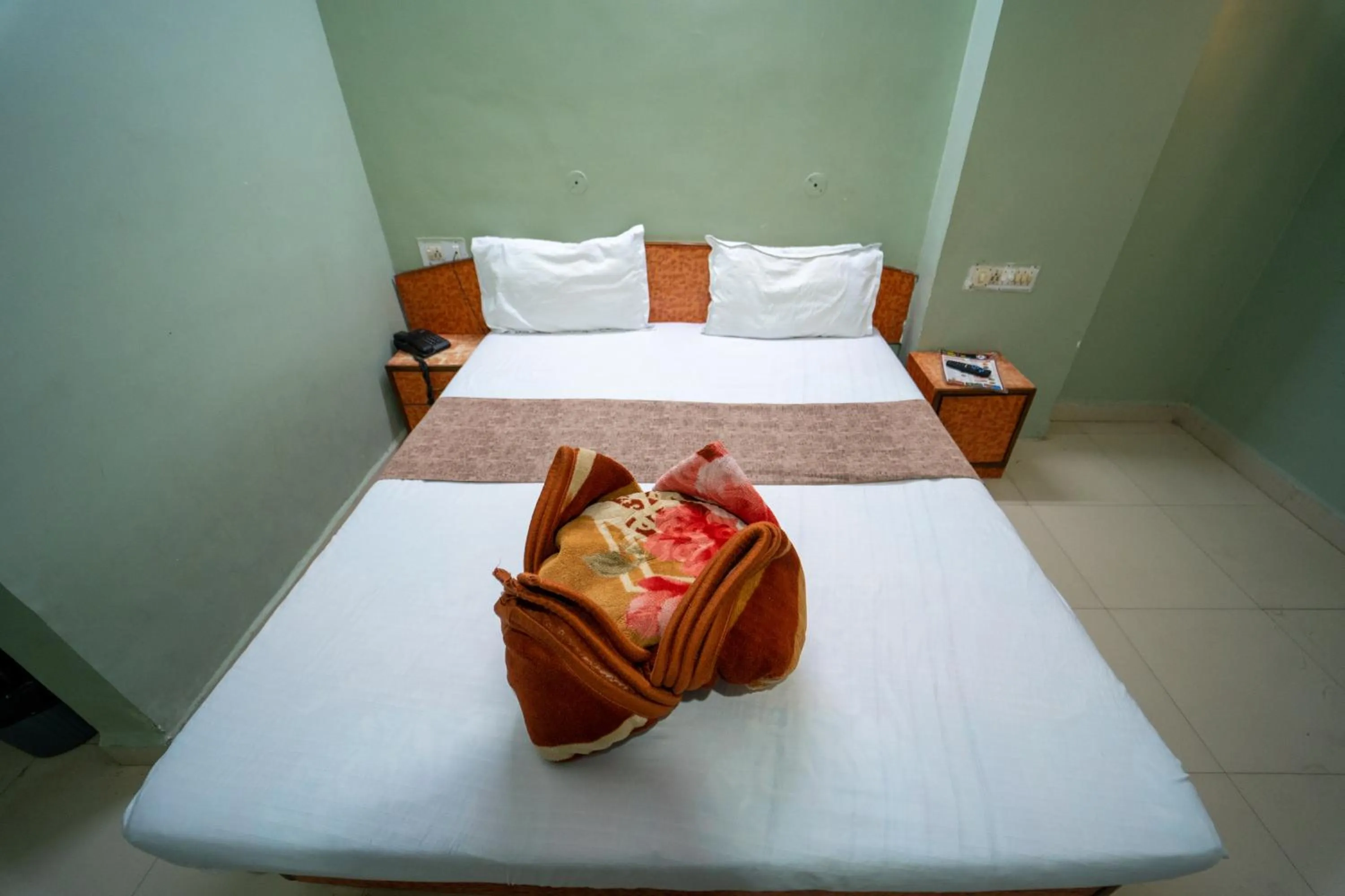 Bed in Hotel Siddhi Vinayak