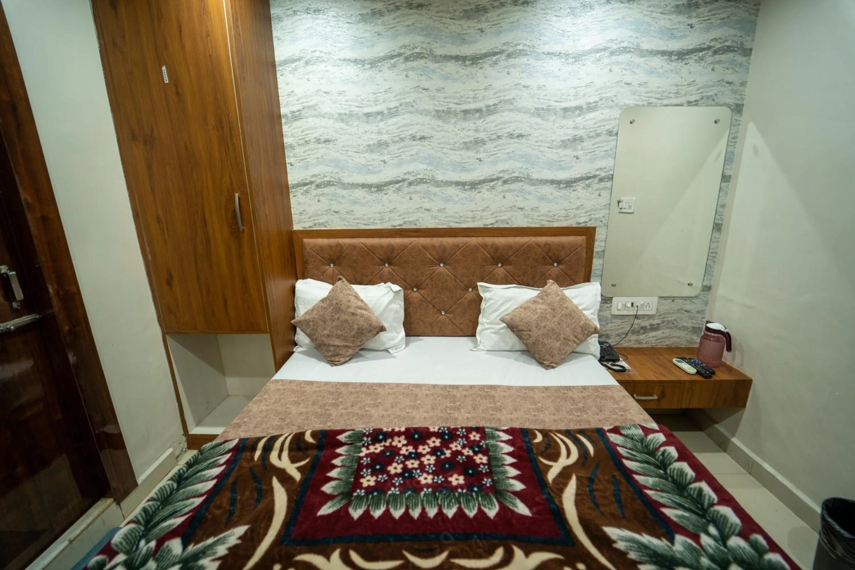 Bed in Hotel Siddhi Vinayak