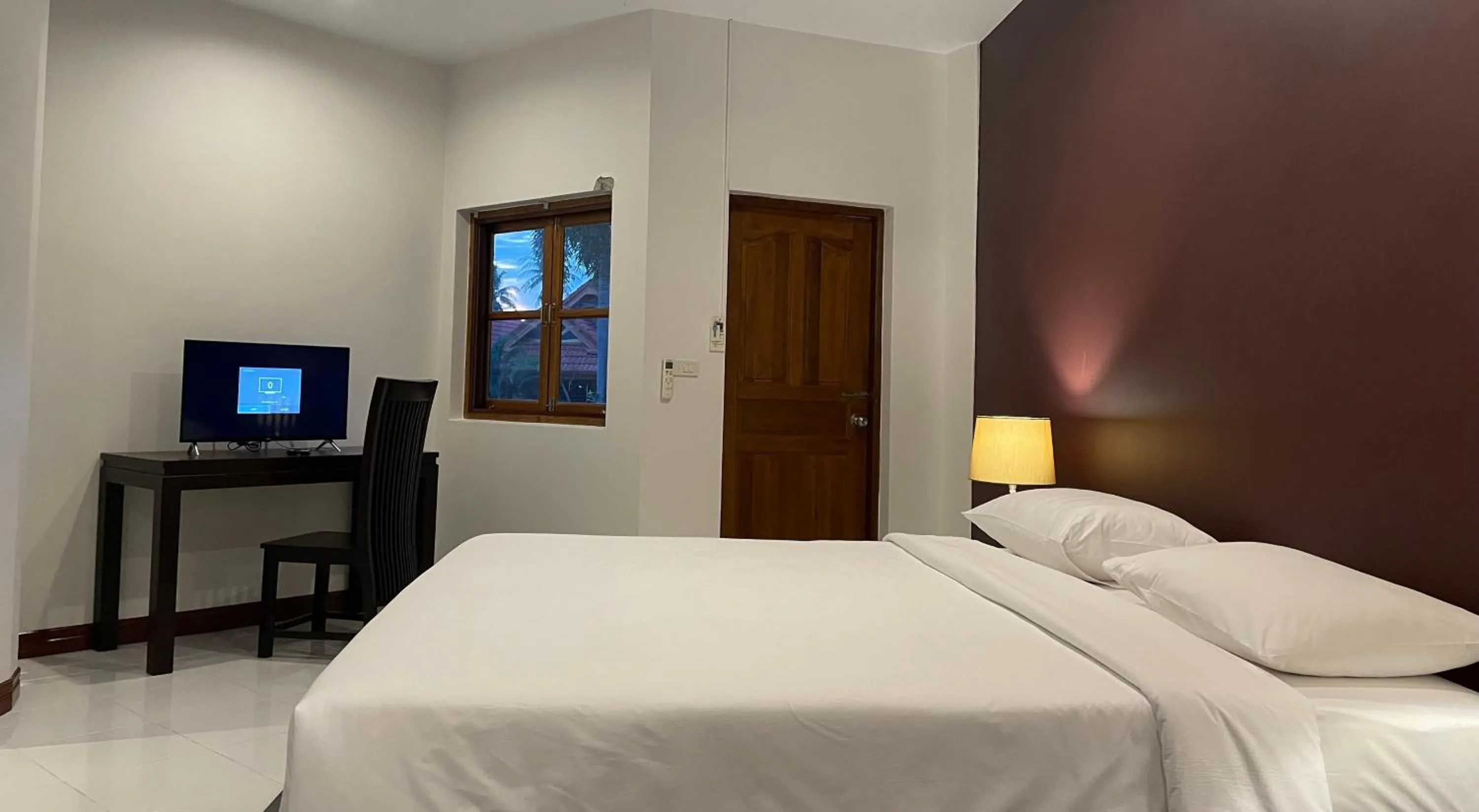 Bed in The Pace Phuket Boutique Resort