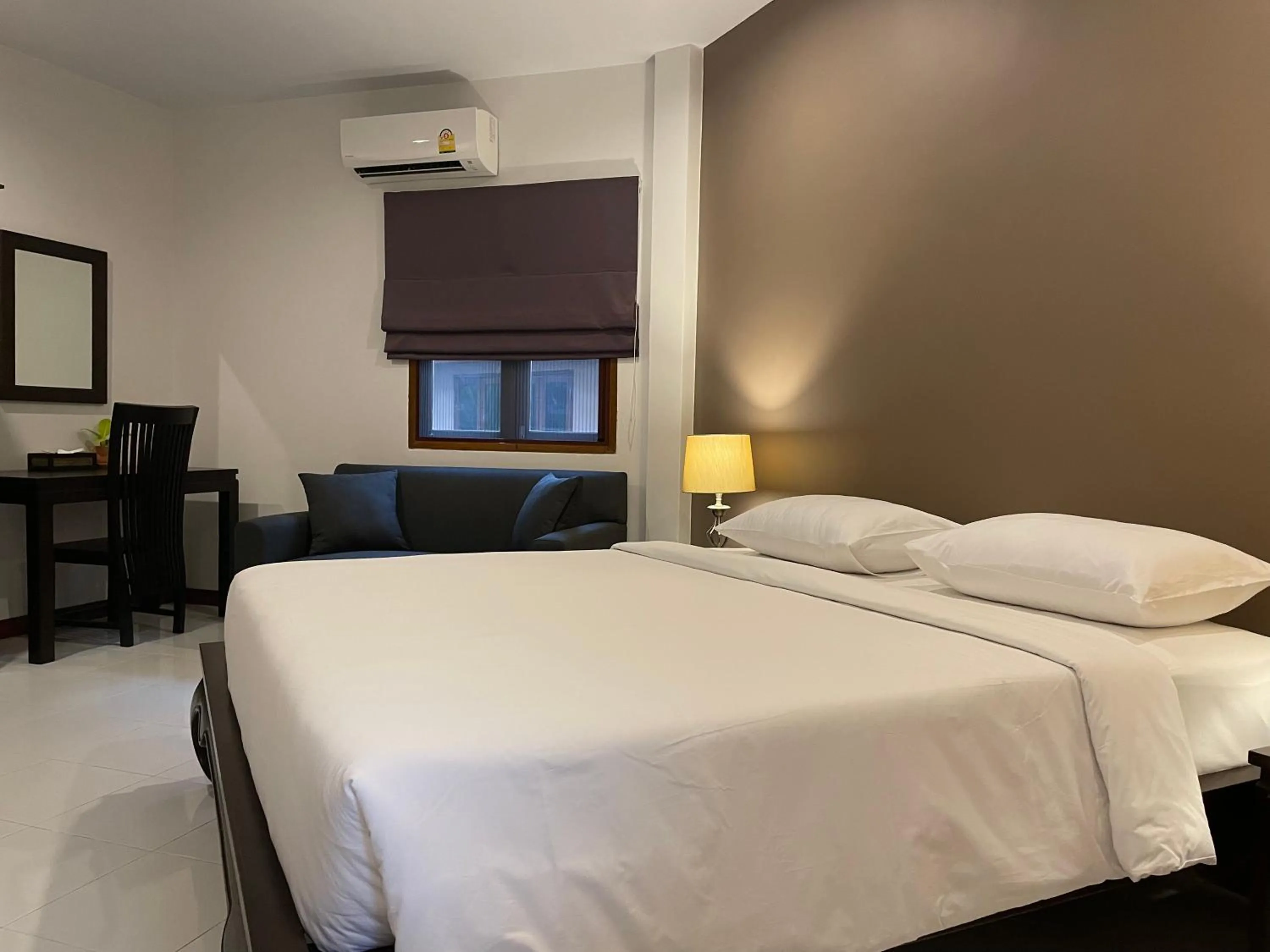 Bed in The Pace Phuket Boutique Resort