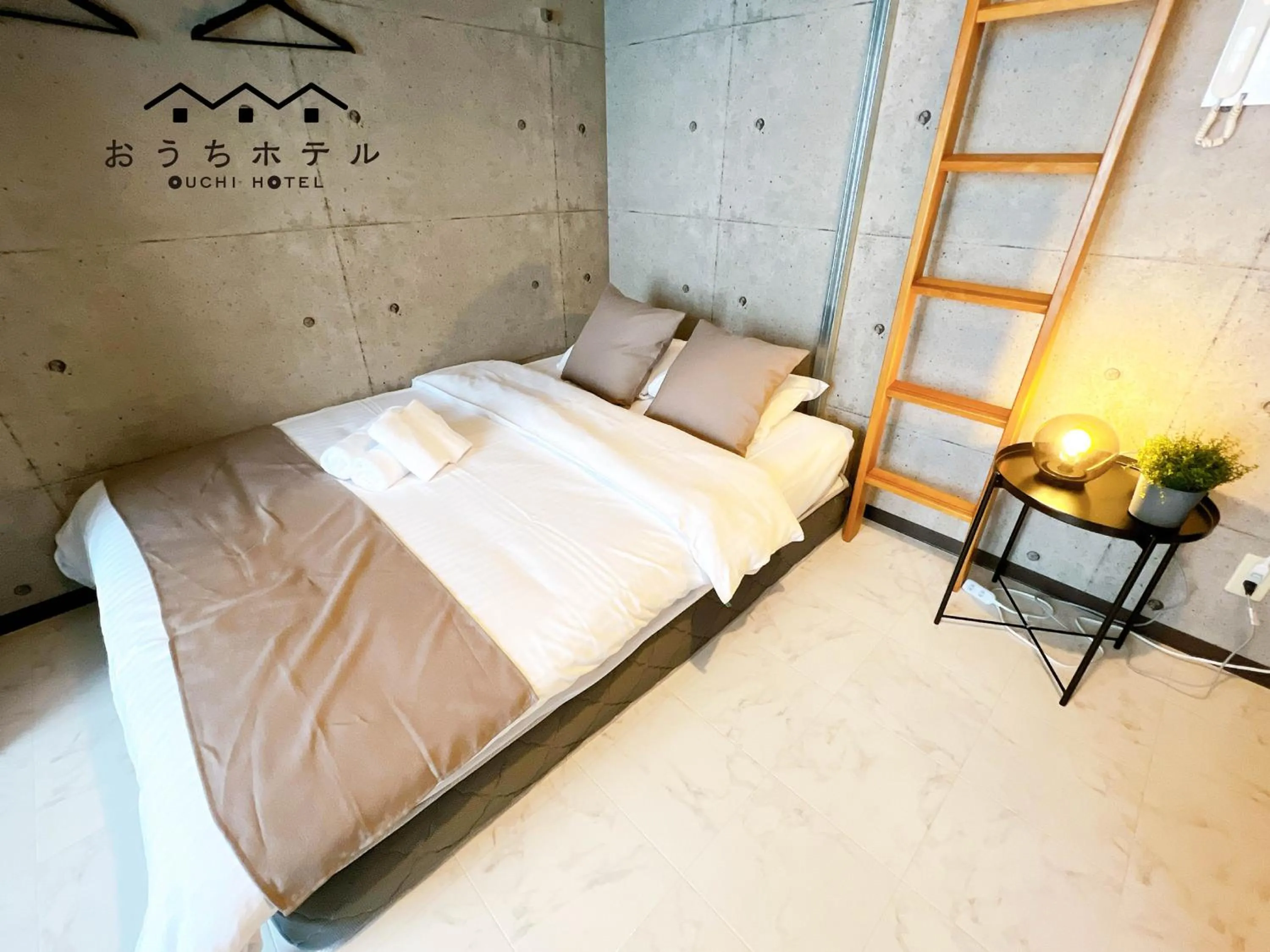 Bed in OUCHI HOTEL Fujimi