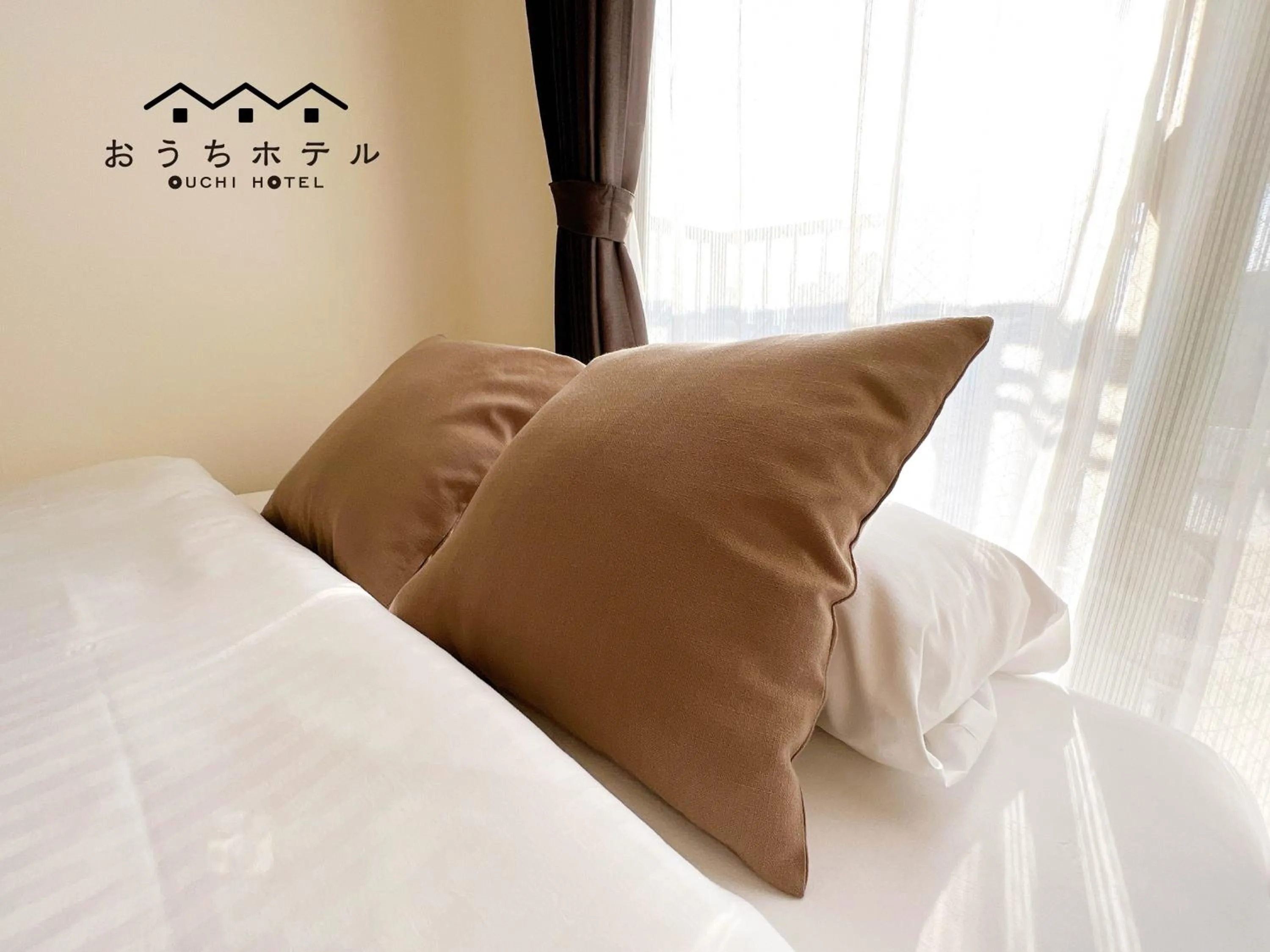 Bed in OUCHI HOTEL Fujimi