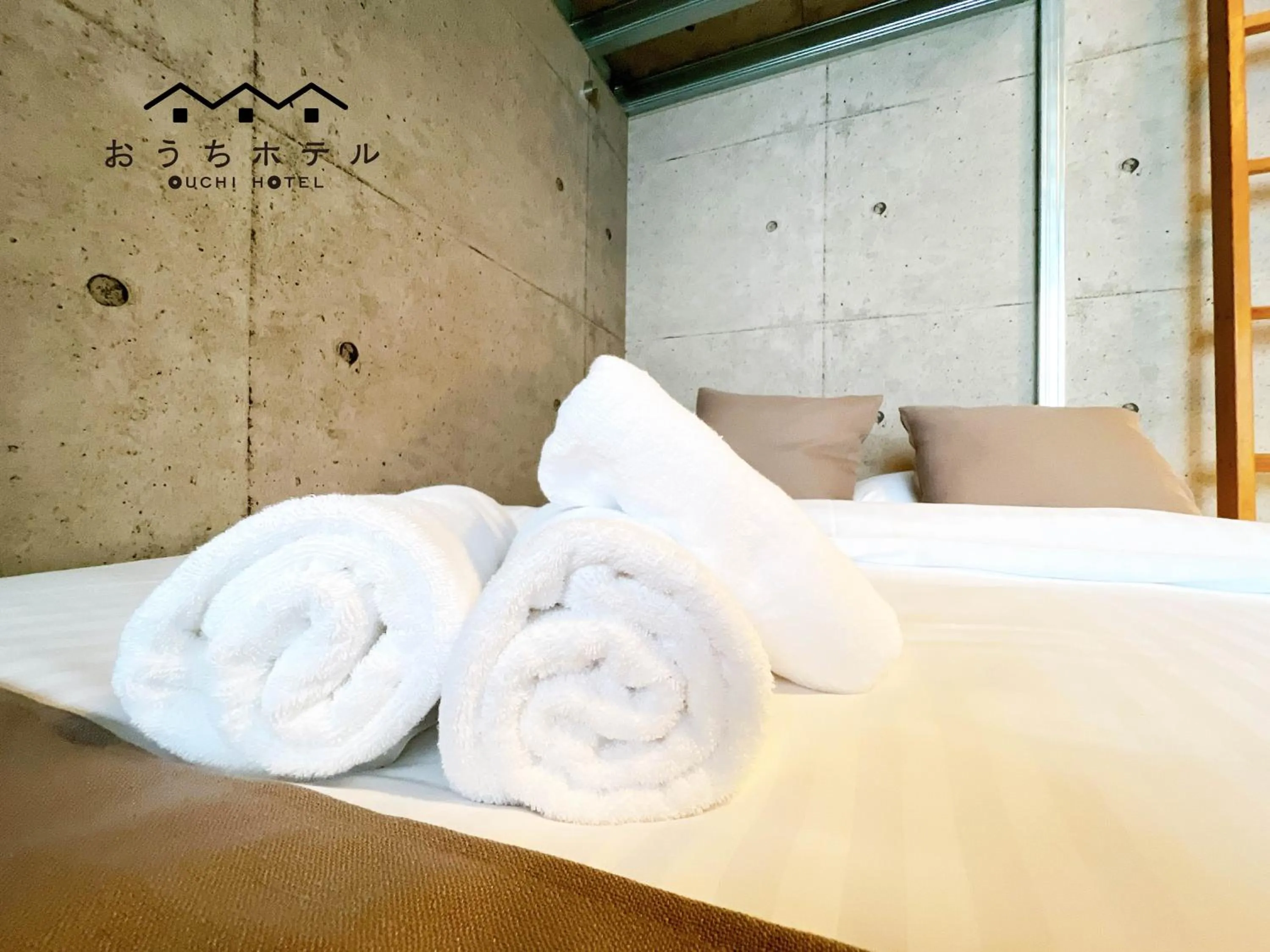 Bed in OUCHI HOTEL Fujimi