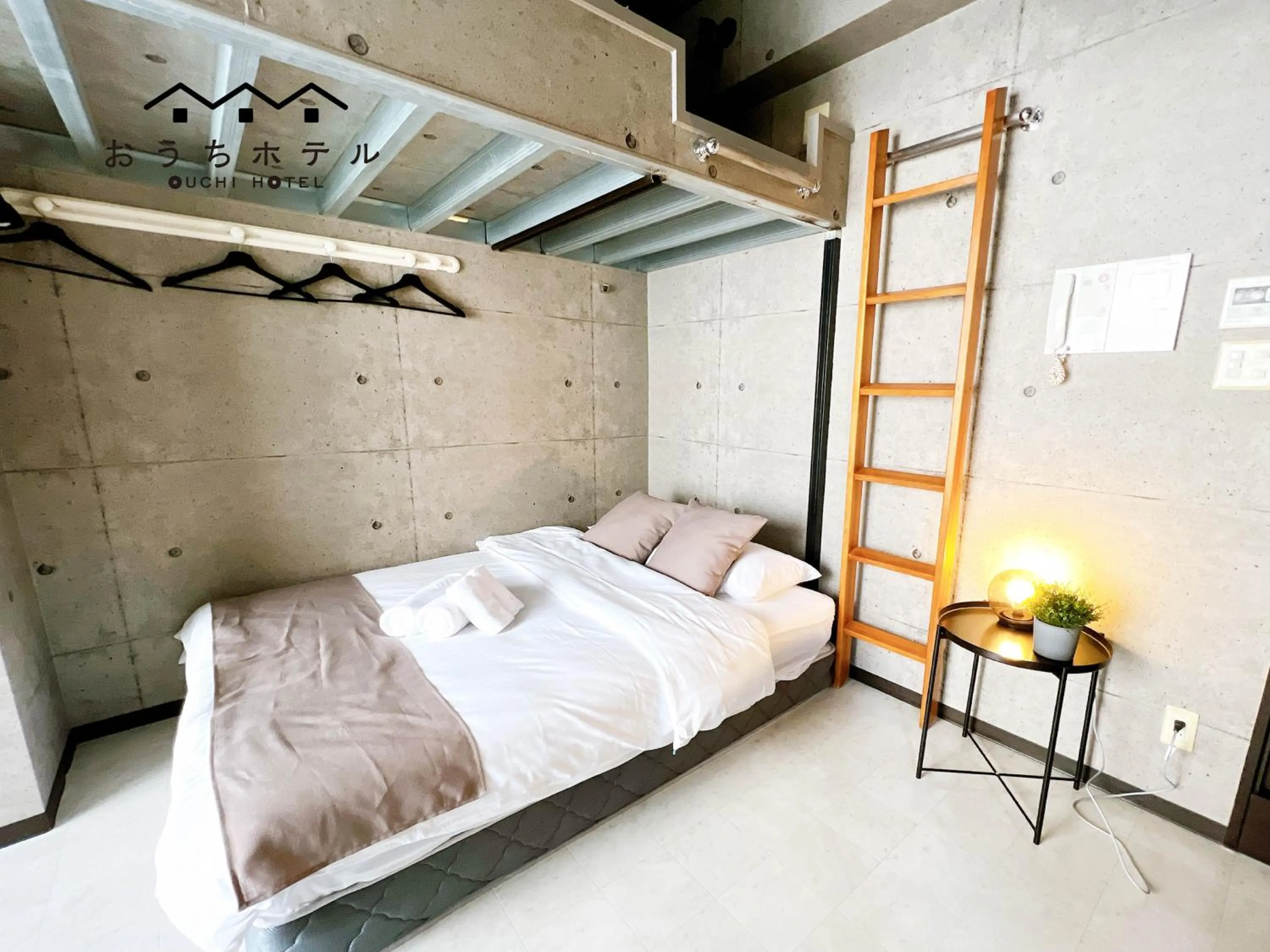 Bed in OUCHI HOTEL Fujimi