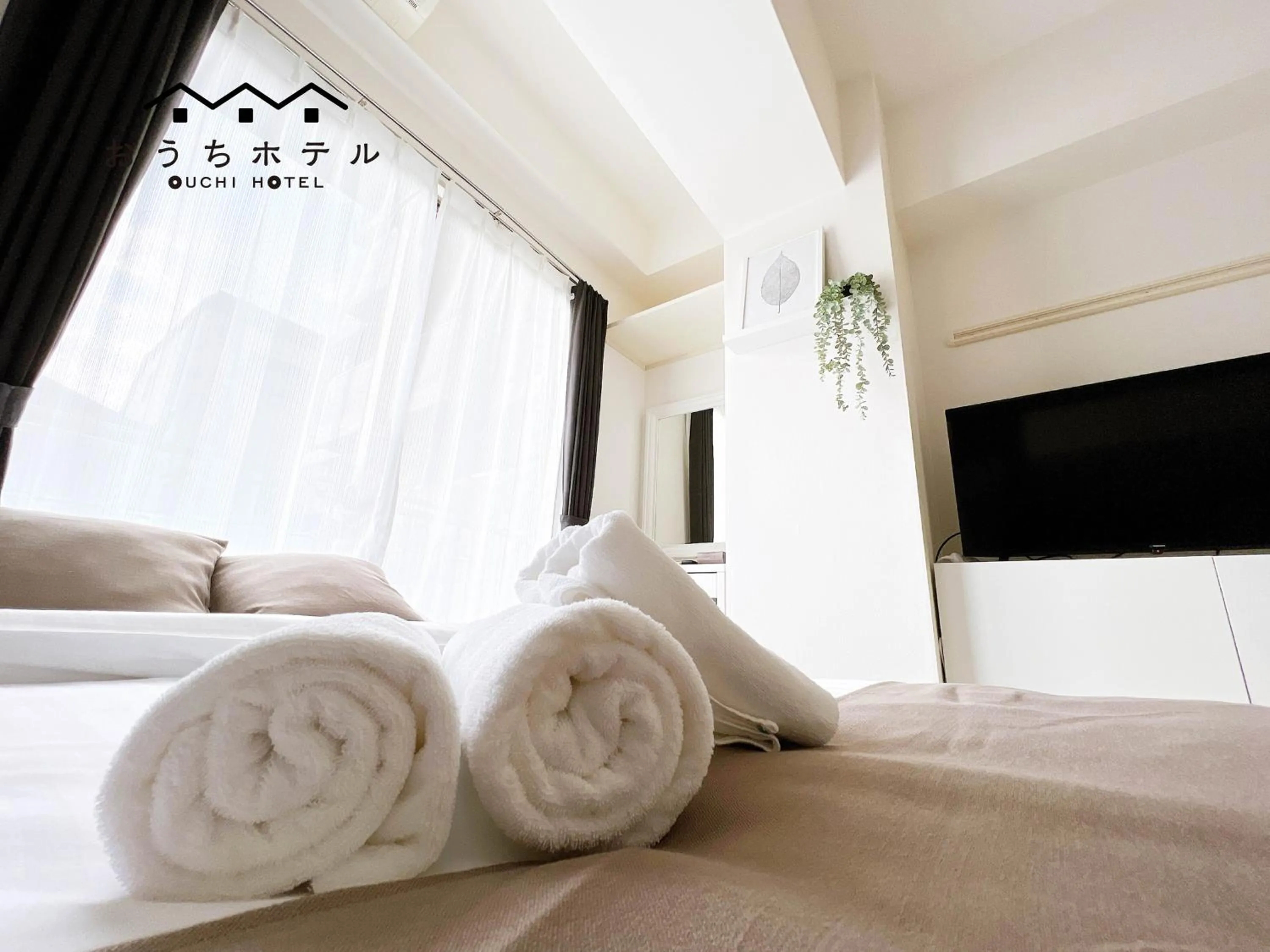 Bed in OUCHI HOTEL Fujimi