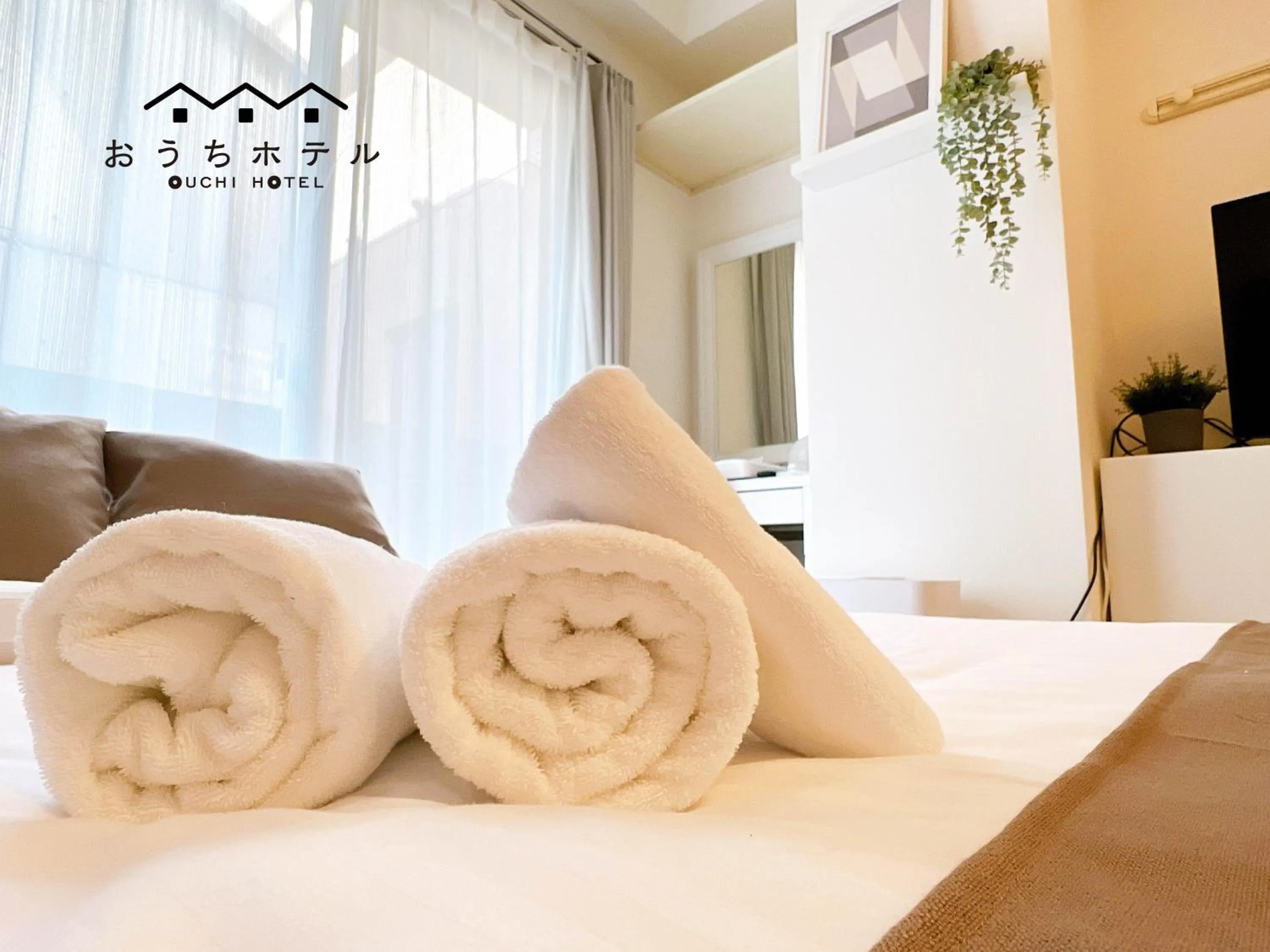 Bed in OUCHI HOTEL Fujimi