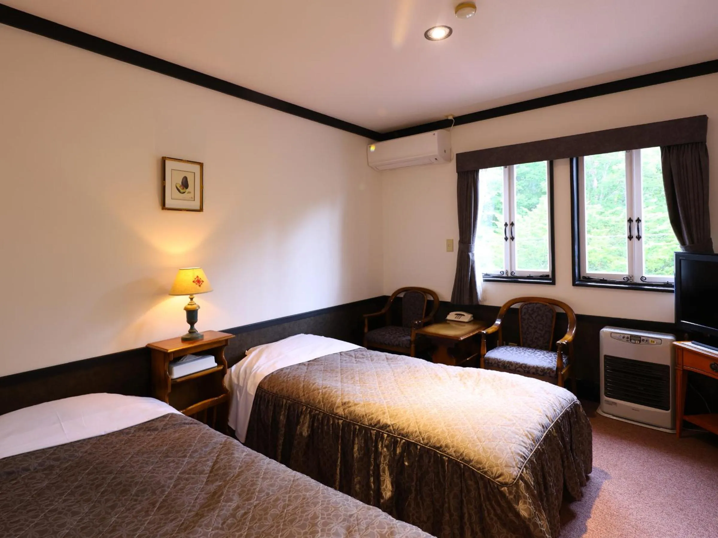 Bed in Petit Hotel & Restaurant Old Age