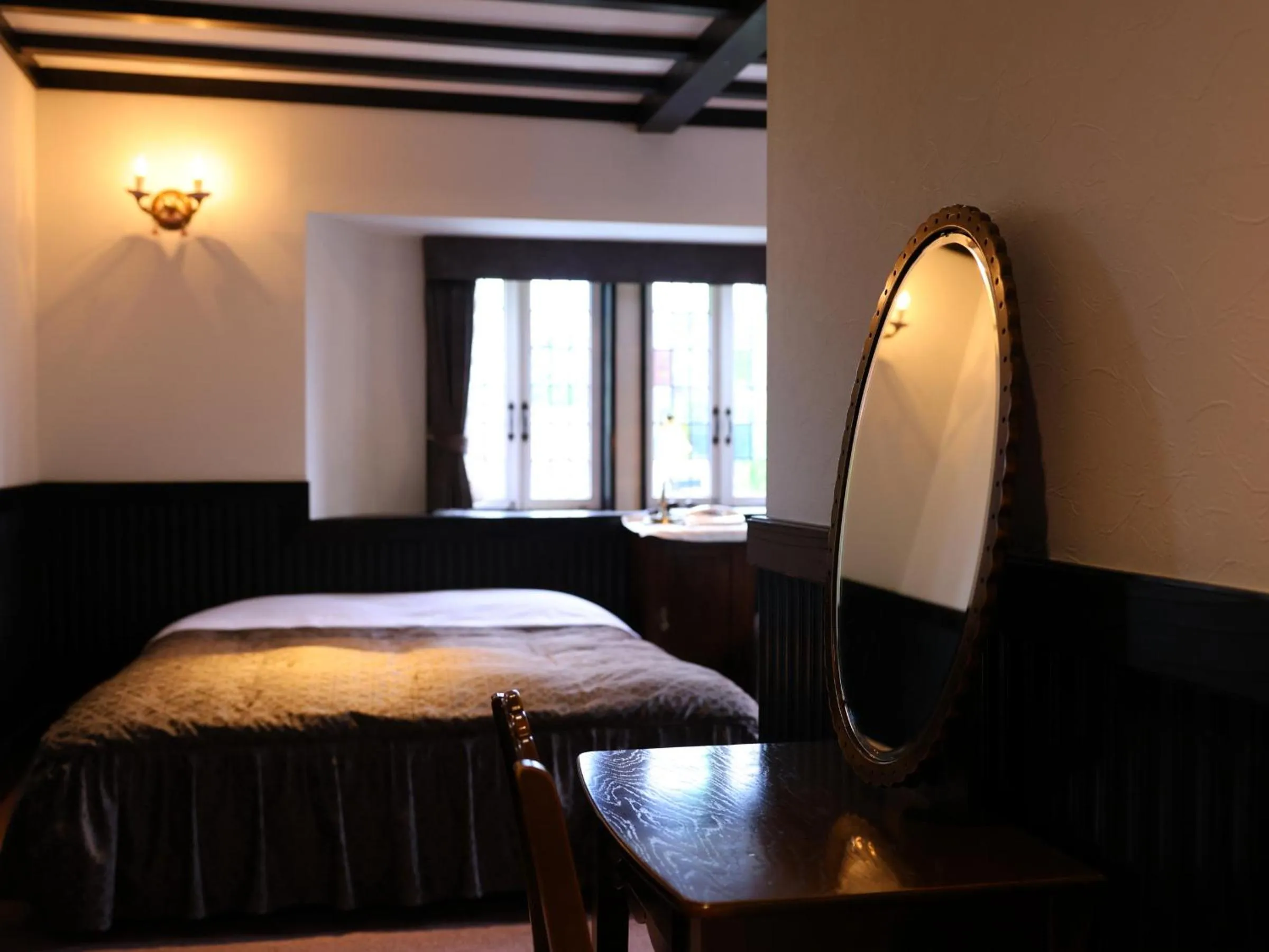 Bed in Petit Hotel & Restaurant Old Age