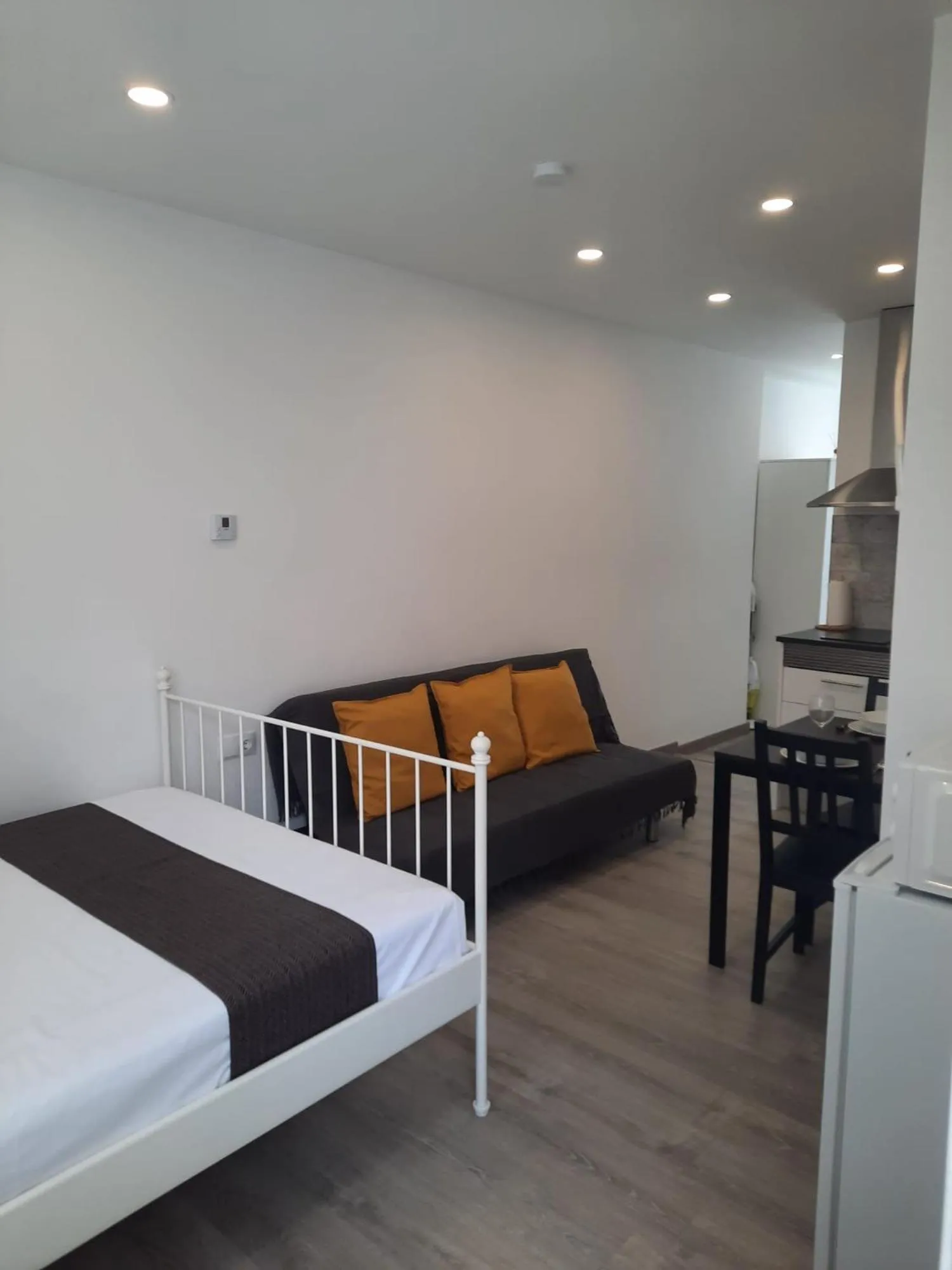 Living room, Bed in Apartaco Apartamentos