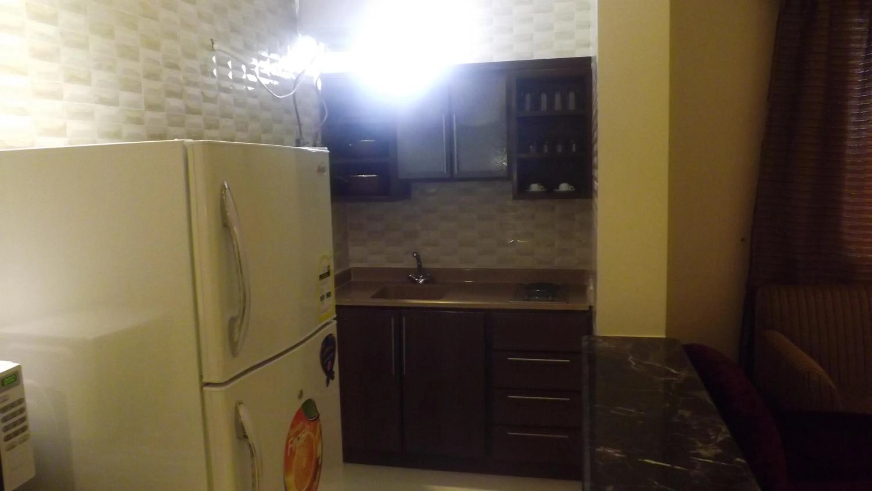 Kitchen or kitchenette in Taleen Serviced Apartments AlMasif