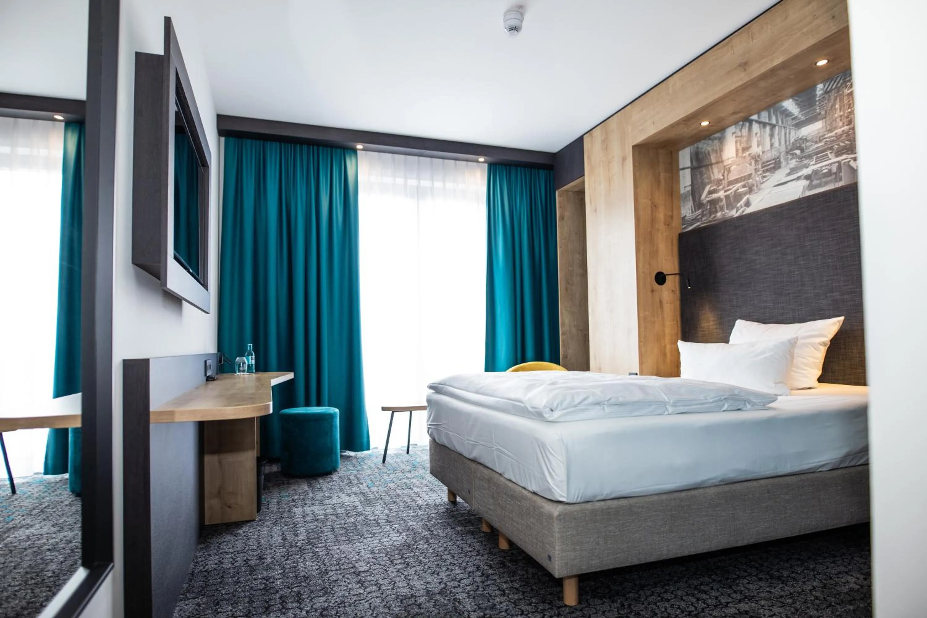 Bed in Das Steinmüller Hotel