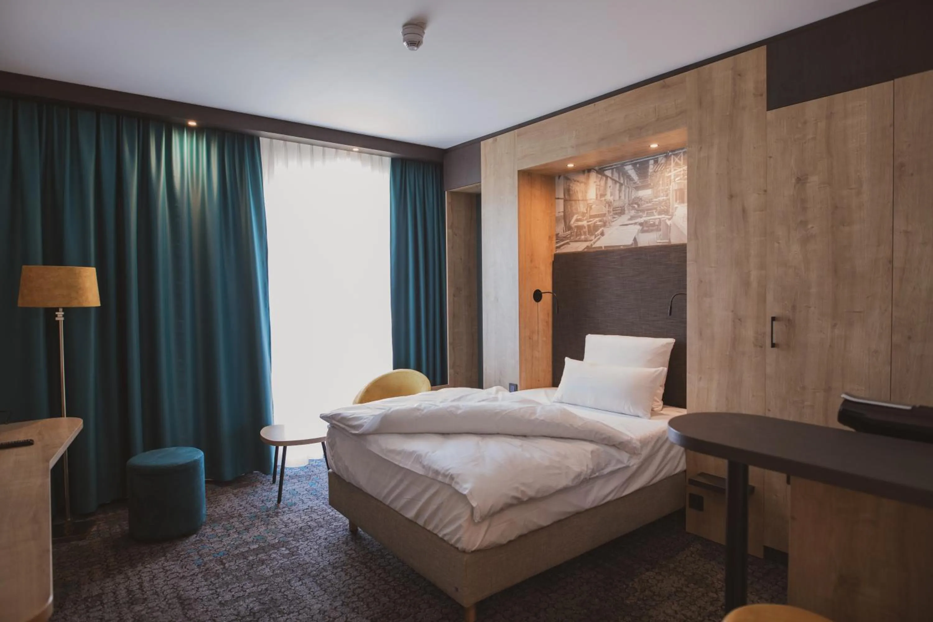 Bed in Das Steinmüller Hotel