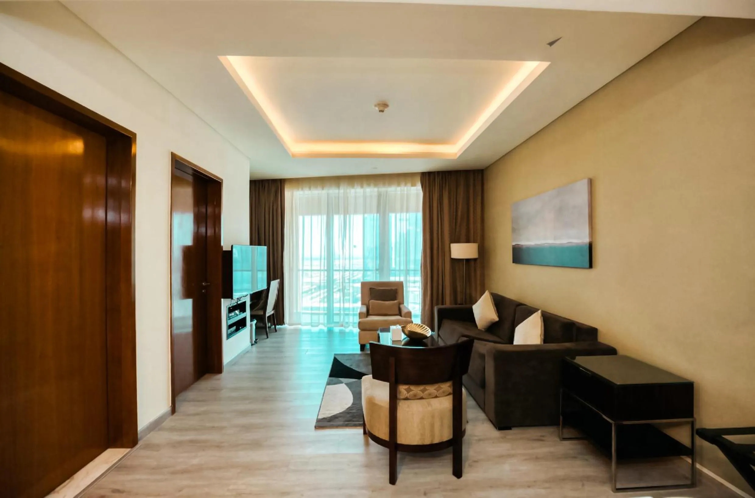 Communal lounge/ TV room in Emaar Fashion Avenue one bedroom - Formerly Address Dubai Mall Four Apple Holiday Homes