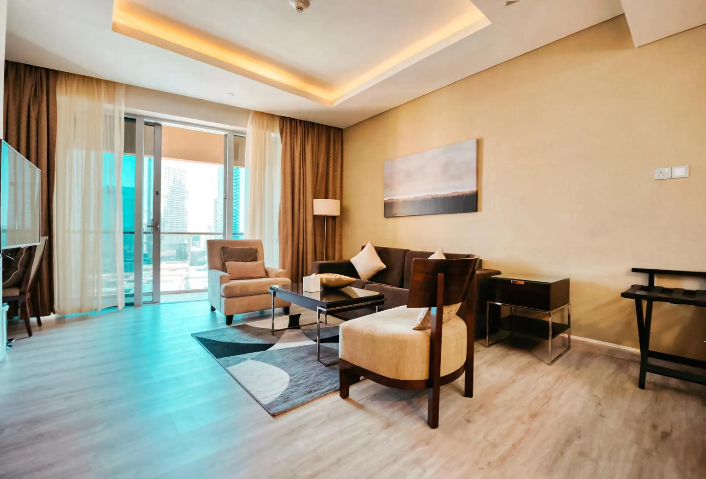 Communal lounge/ TV room in Emaar Fashion Avenue one bedroom - Formerly Address Dubai Mall Four Apple Holiday Homes