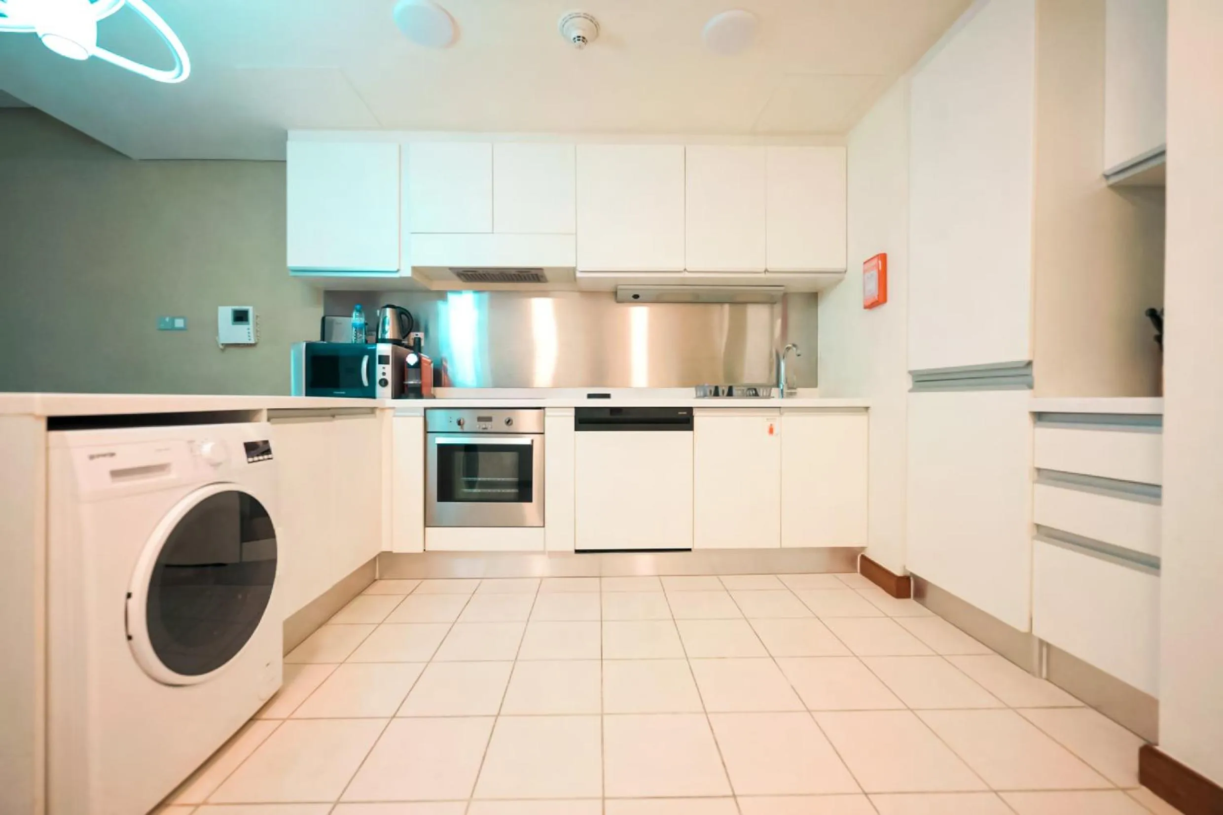 Kitchen or kitchenette in Emaar Fashion Avenue one bedroom - Formerly Address Dubai Mall Four Apple Holiday Homes