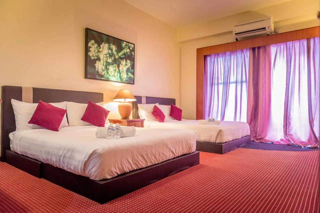 Photo of the whole room, Bed in J Beach Suites At Rainbow Paradise