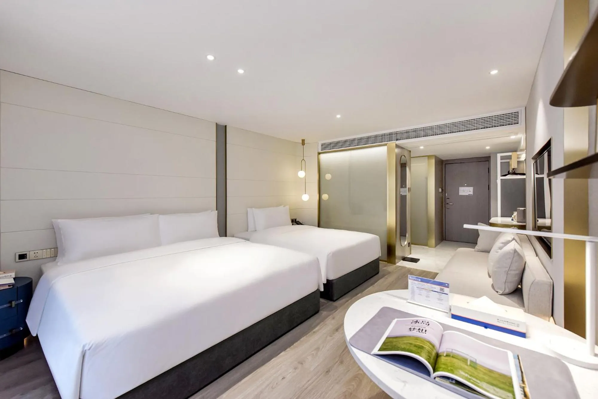 Bed in Kuanrong Suites Hotel Liangjiang love sea shopping park