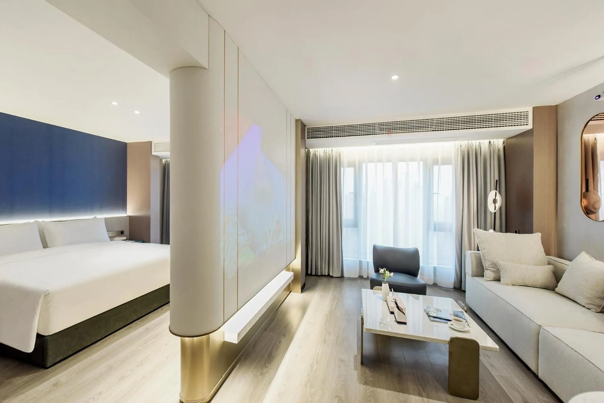 Seating area, Bed in Kuanrong Suites Hotel Liangjiang love sea shopping park