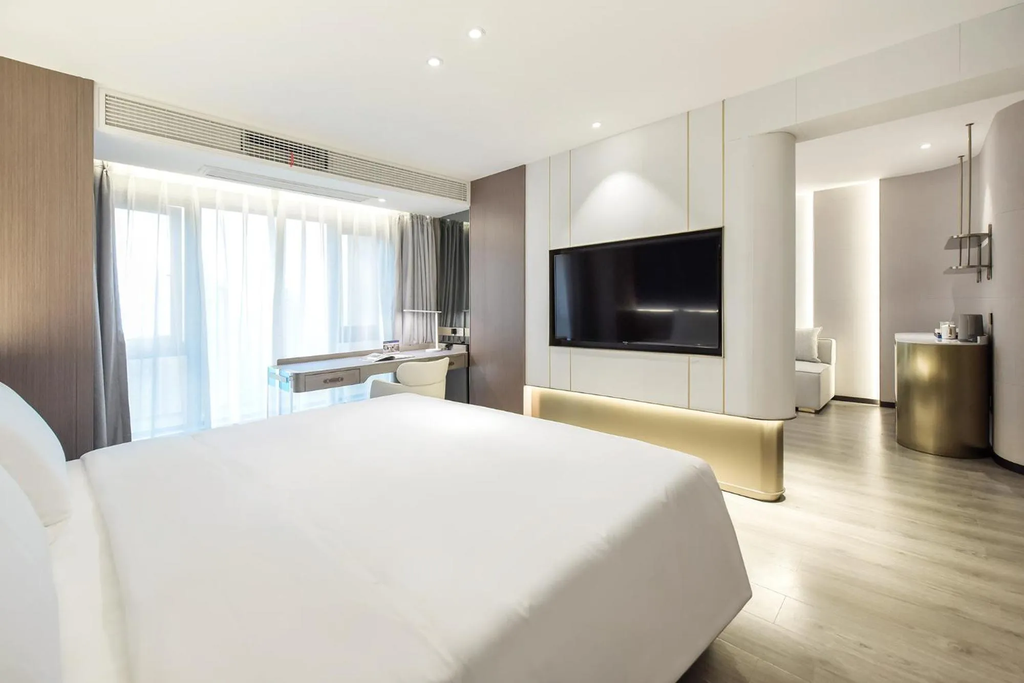 Bed in Kuanrong Suites Hotel Liangjiang love sea shopping park