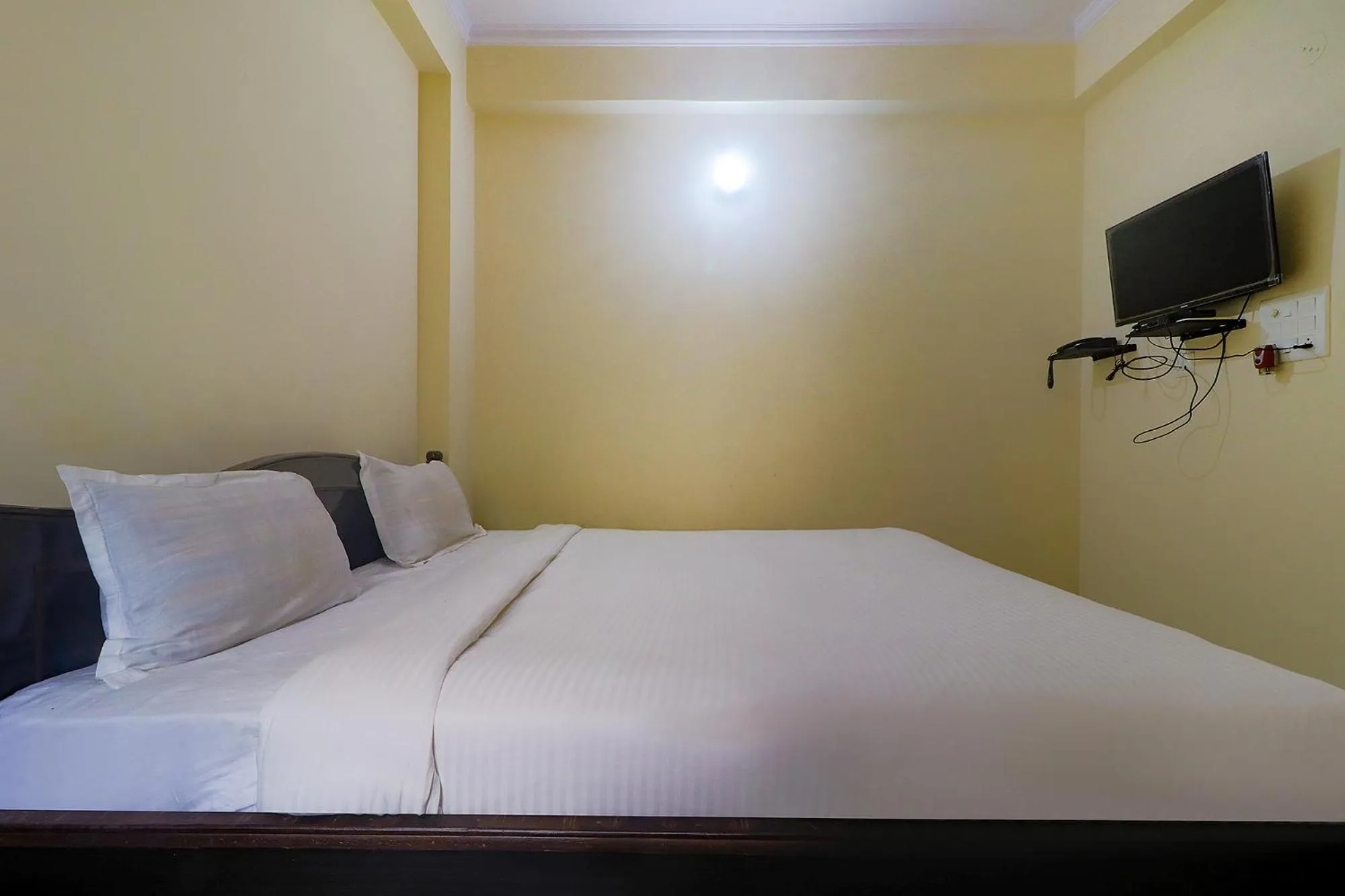 Bed in FabHotel Buddha Residency