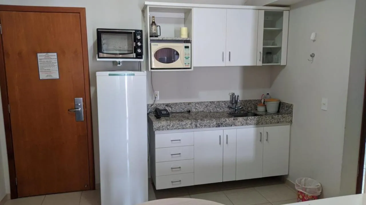 Kitchen or kitchenette in Águas da Serra Apart Hotel