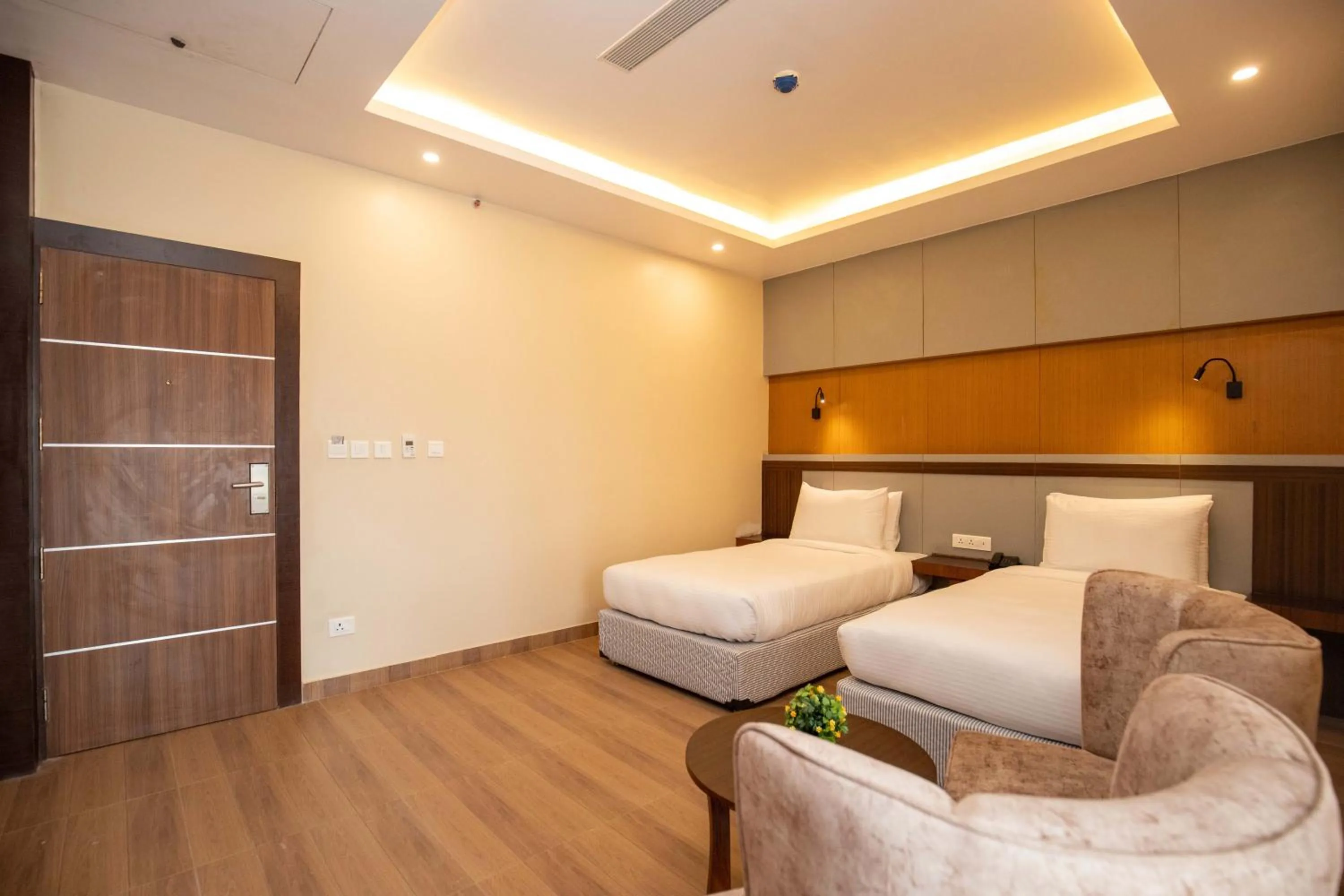 Bed in Hotel Palm International