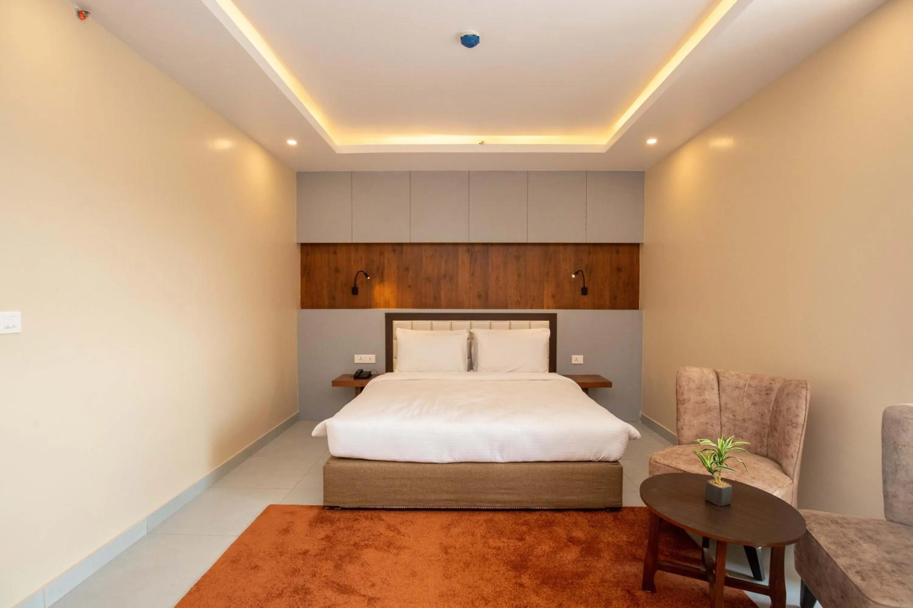 Bed in Hotel Palm International