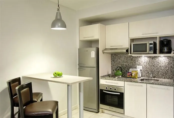 Kitchen or kitchenette in Piccaluga Apartments