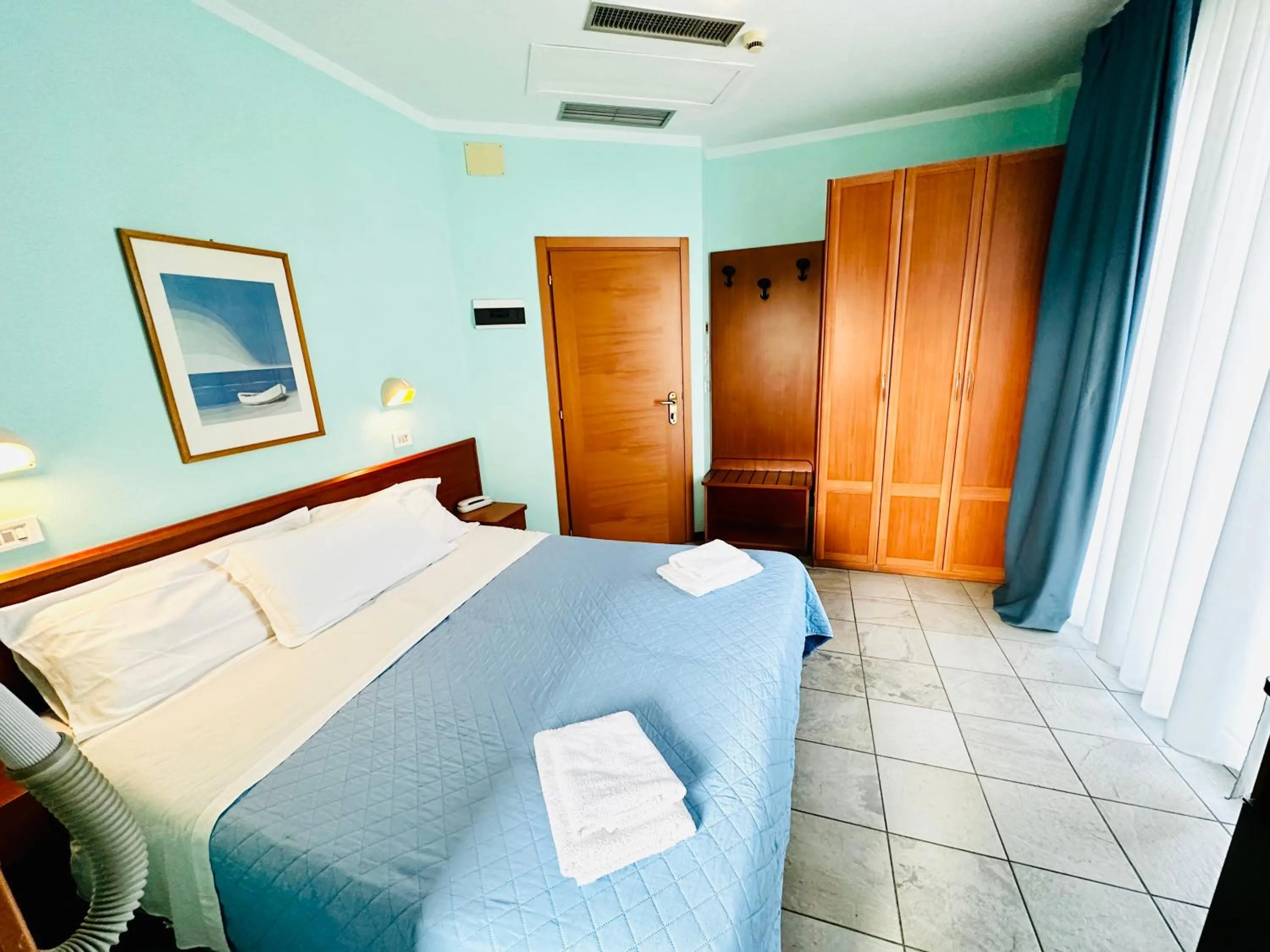 Bed in Hotel Blue Moon