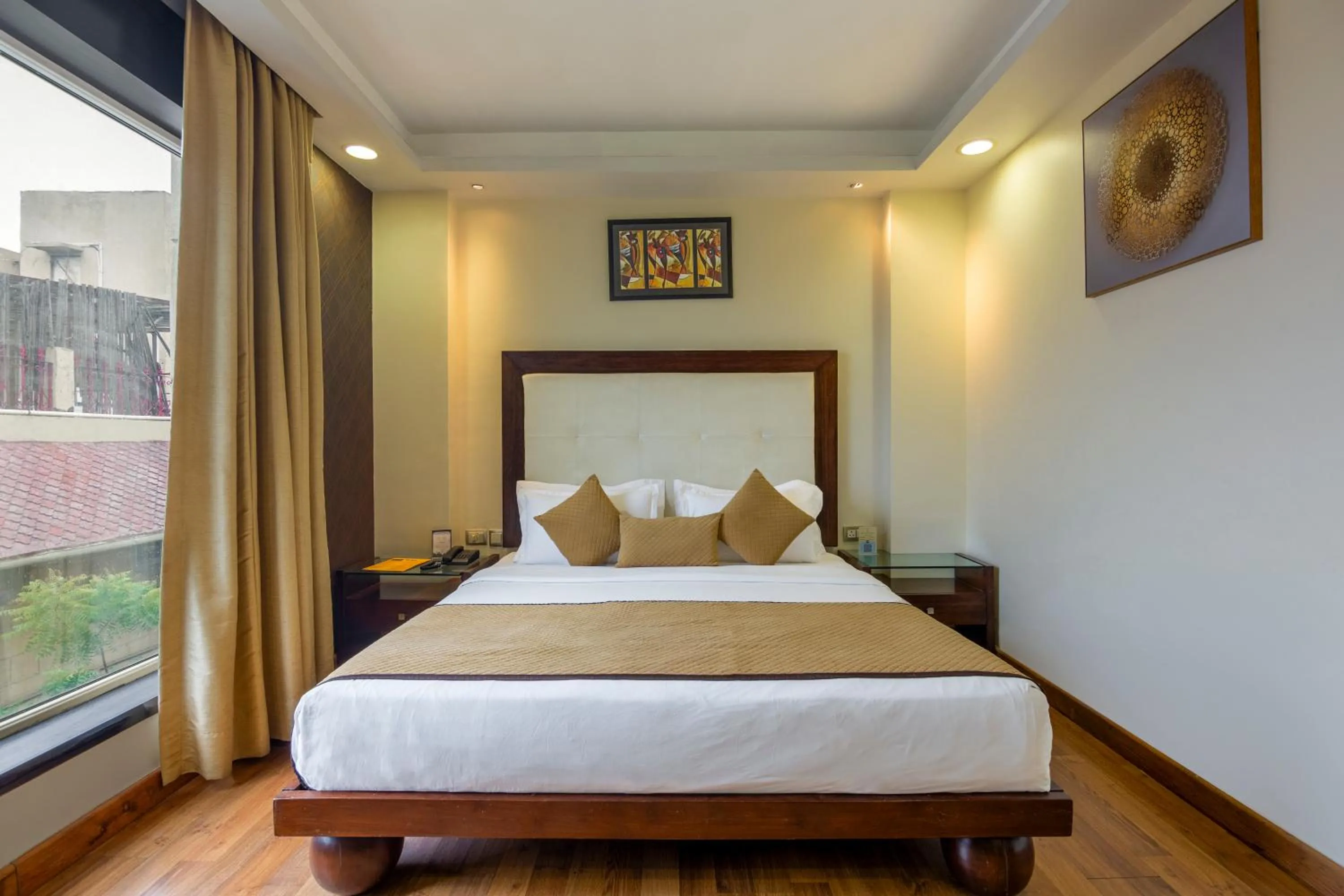 Bed in The Grand Orion - Kailash Colony