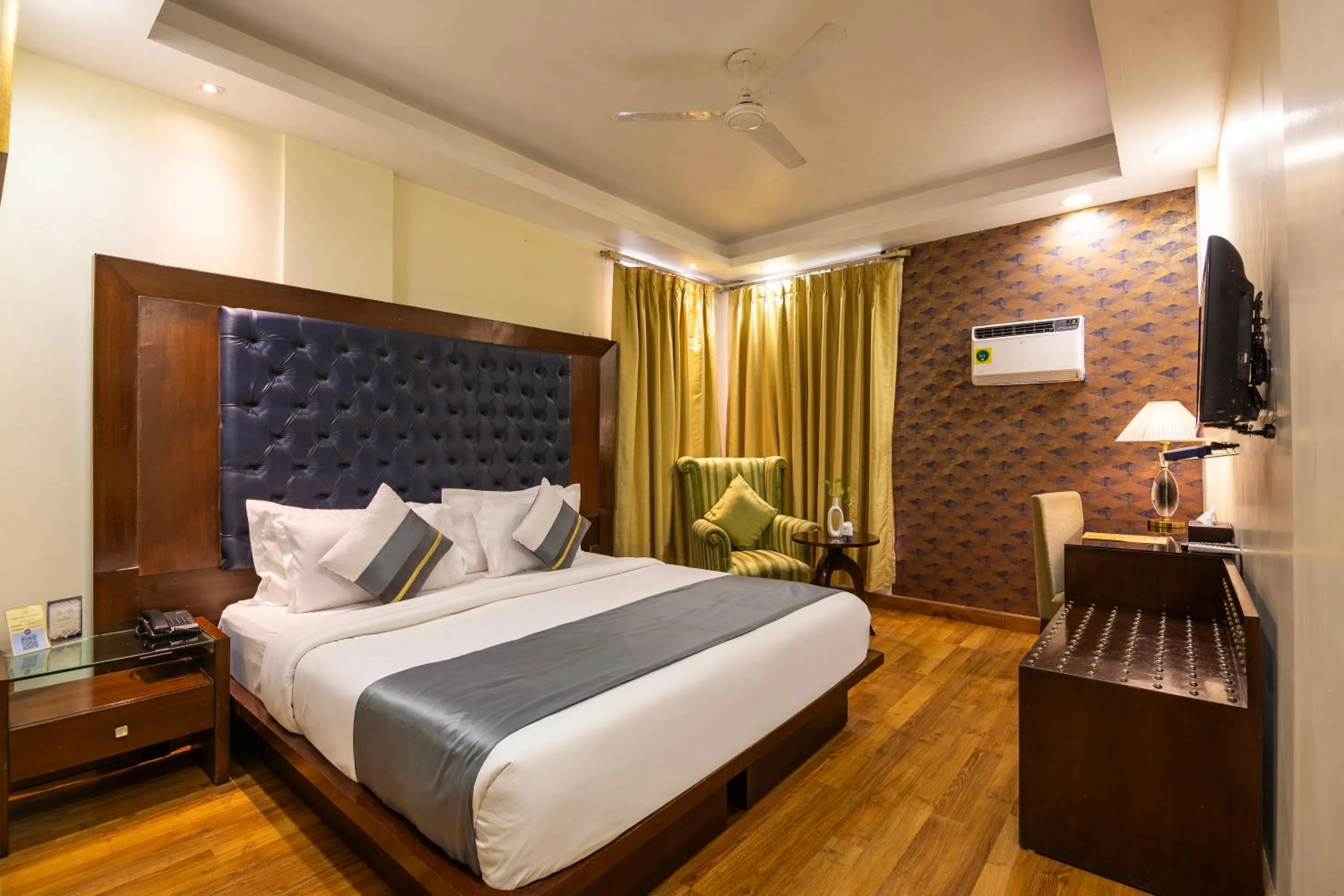 Photo of the whole room, Bed in The Grand Orion - Kailash Colony