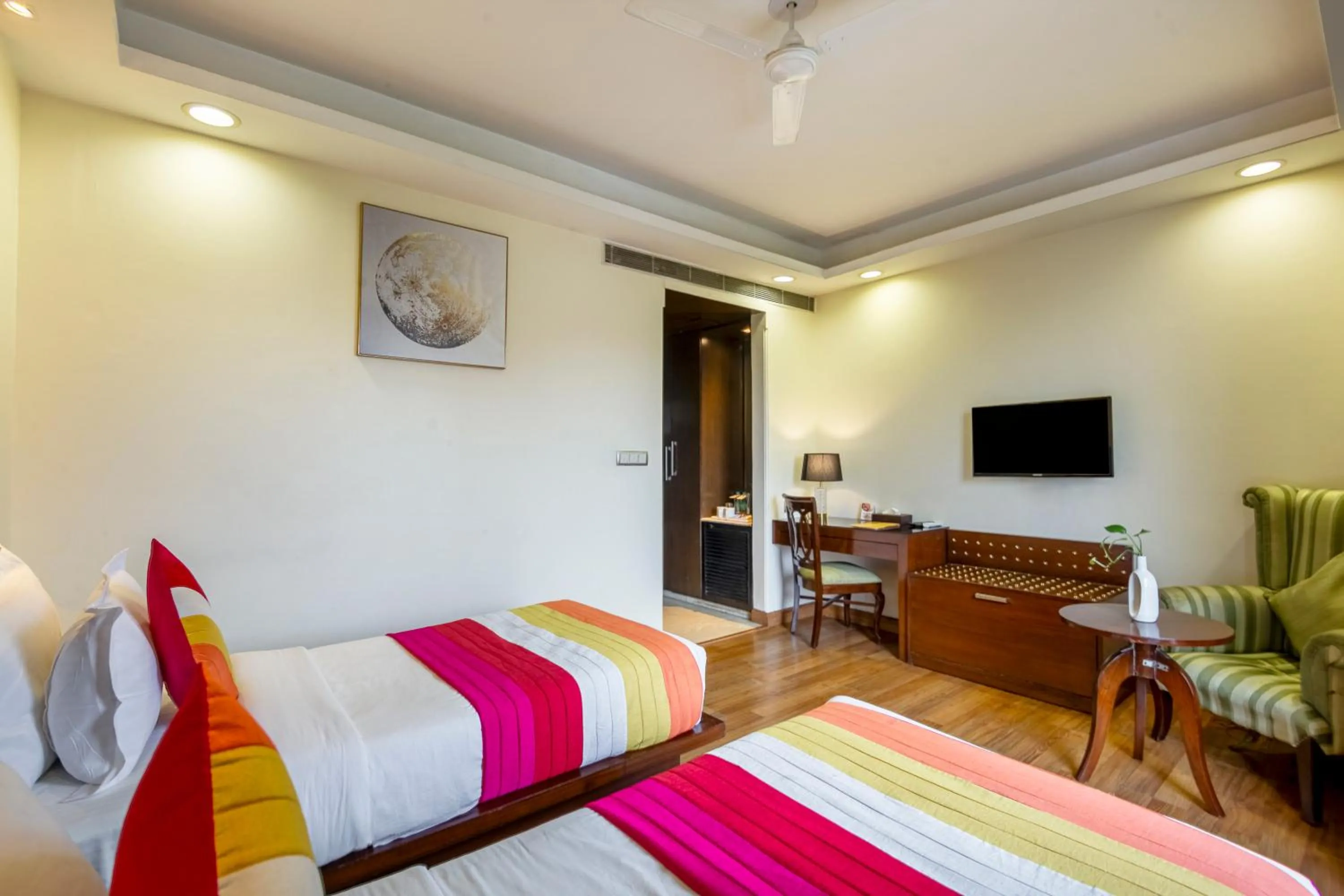 Bed in The Grand Orion - Kailash Colony