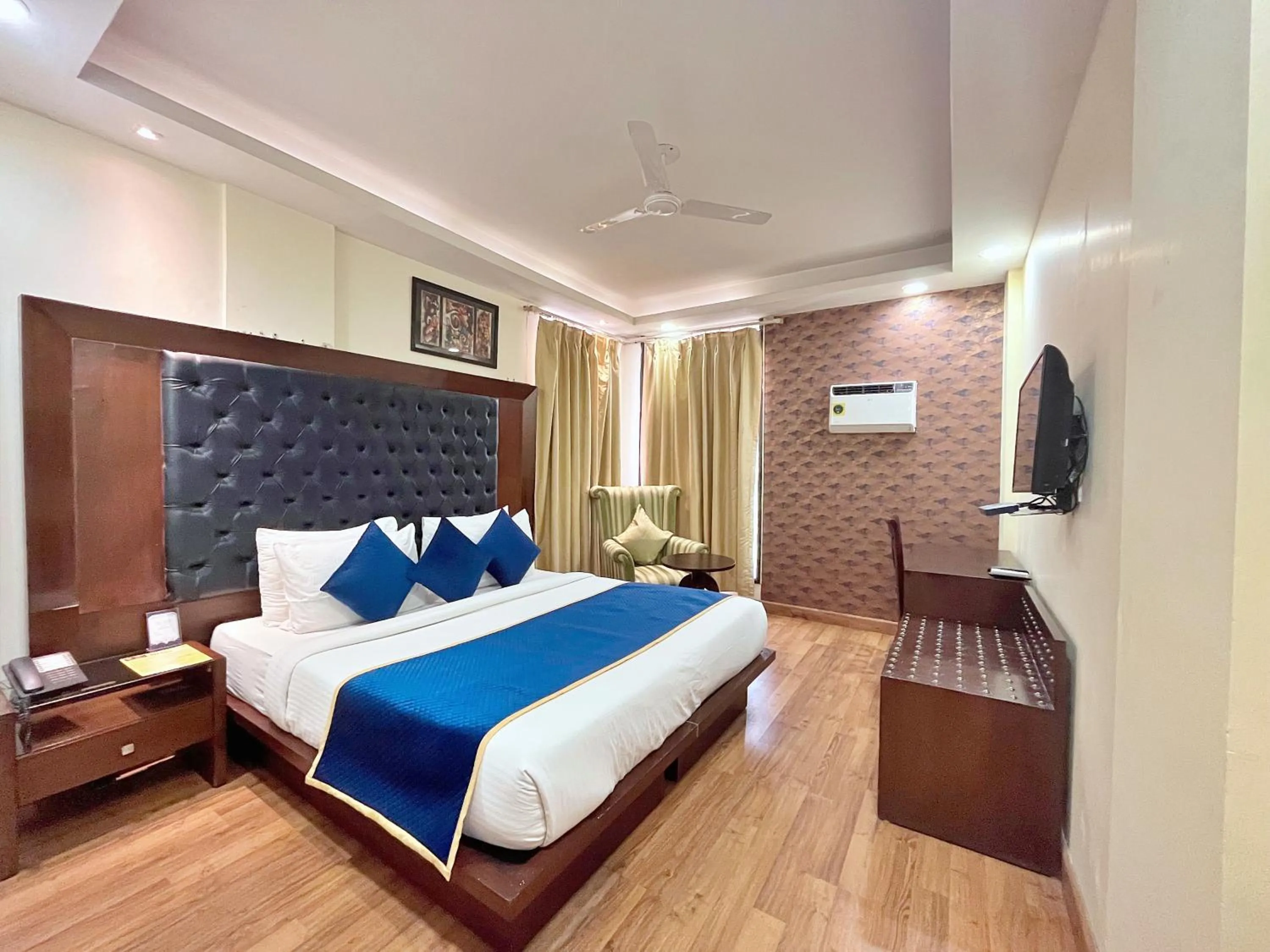 Bed in The Grand Orion - Kailash Colony