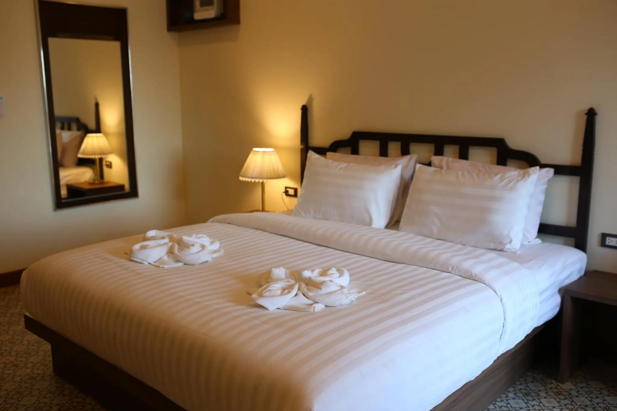 Bed in Baan Chao Khun Hotel