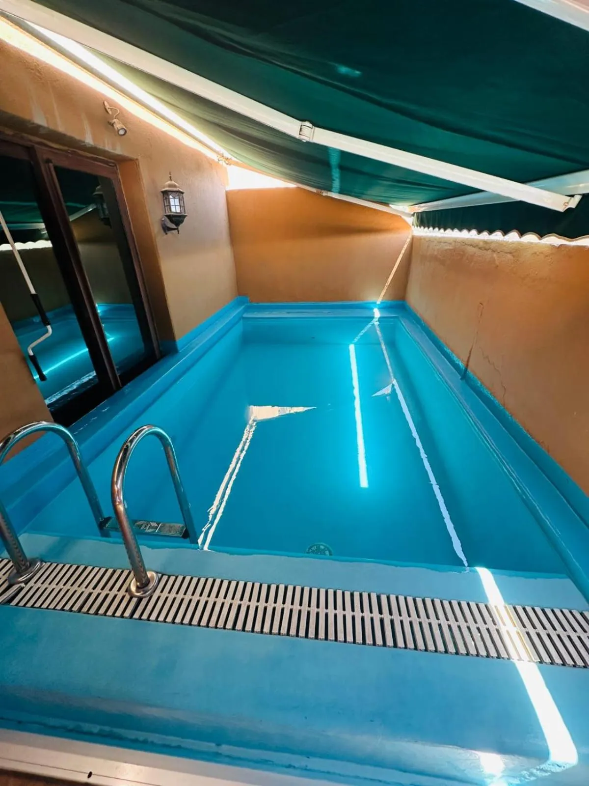 Swimming pool in The Convention Center & Royal Suites Hotel