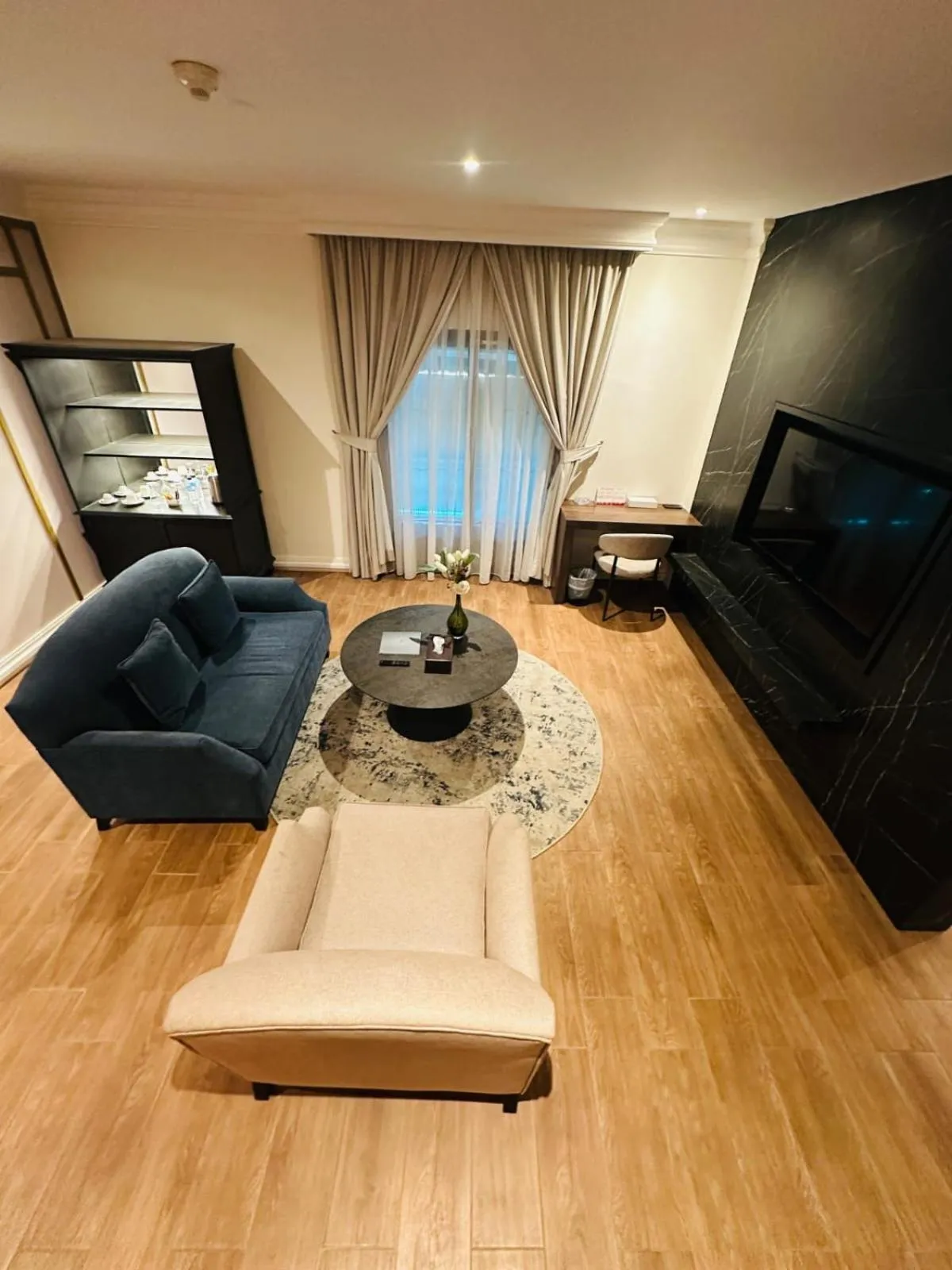 Living room in The Convention Center & Royal Suites Hotel