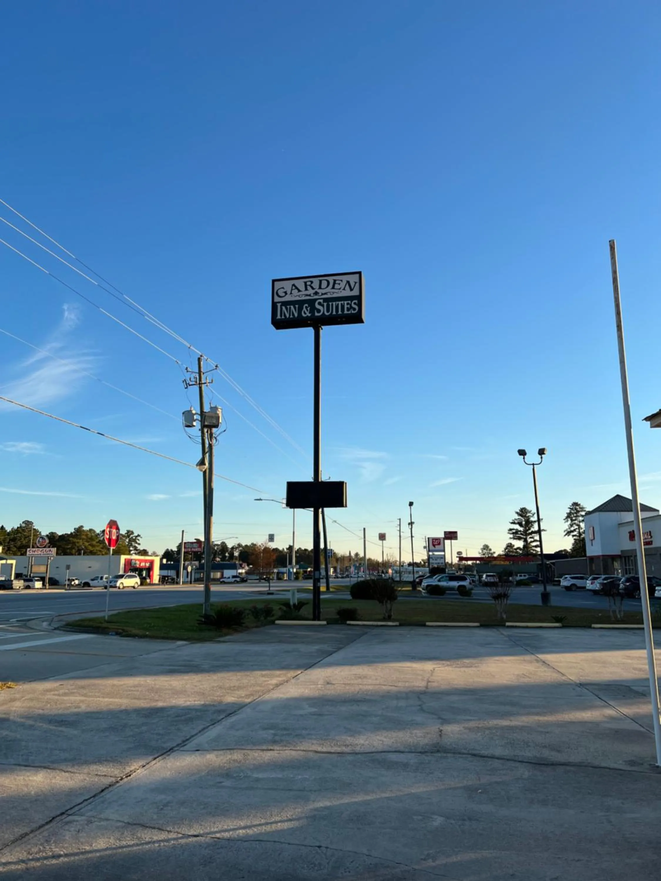 Property logo or sign in Garden Inn & Suites