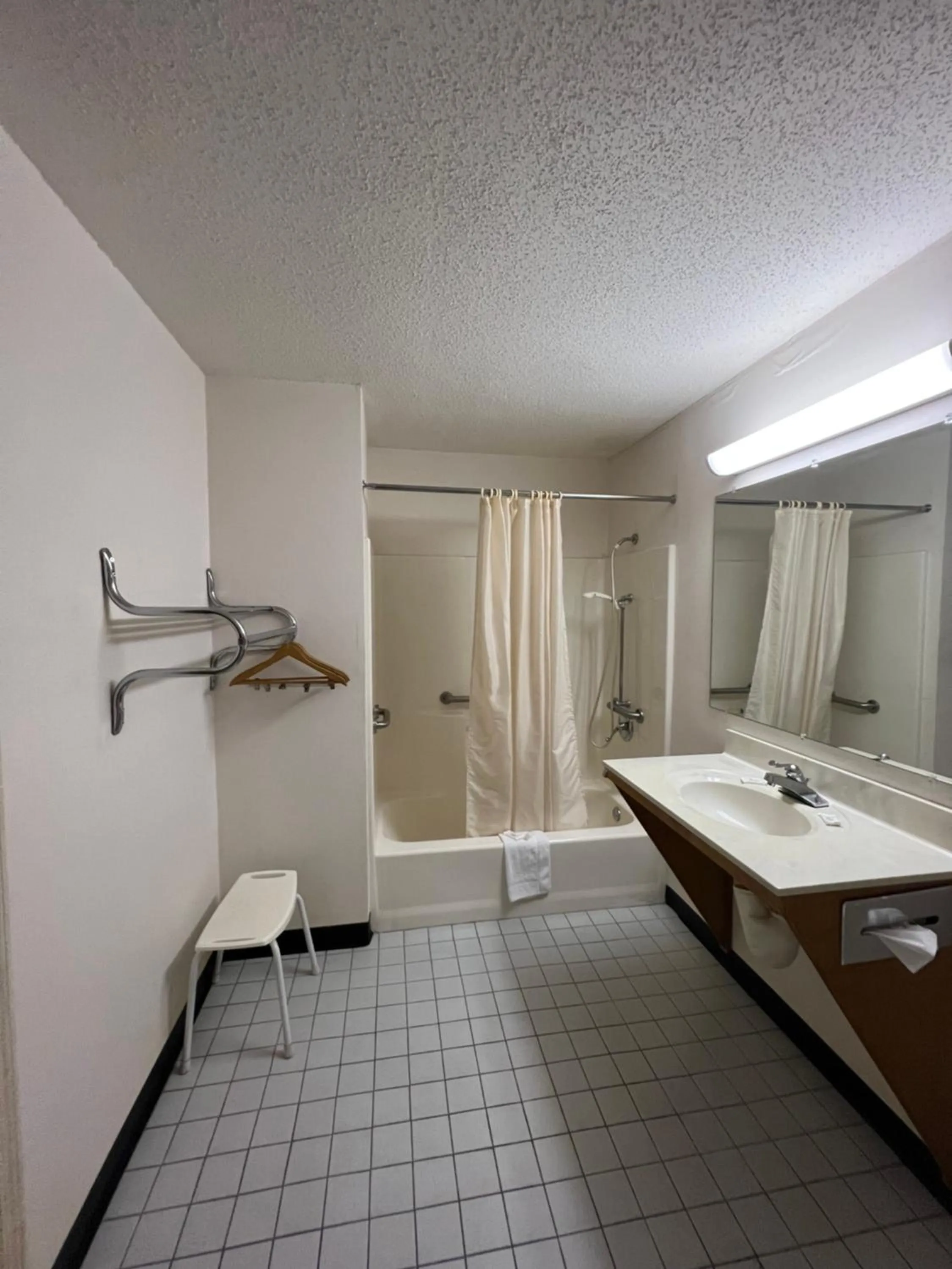 Bathroom in Garden Inn & Suites